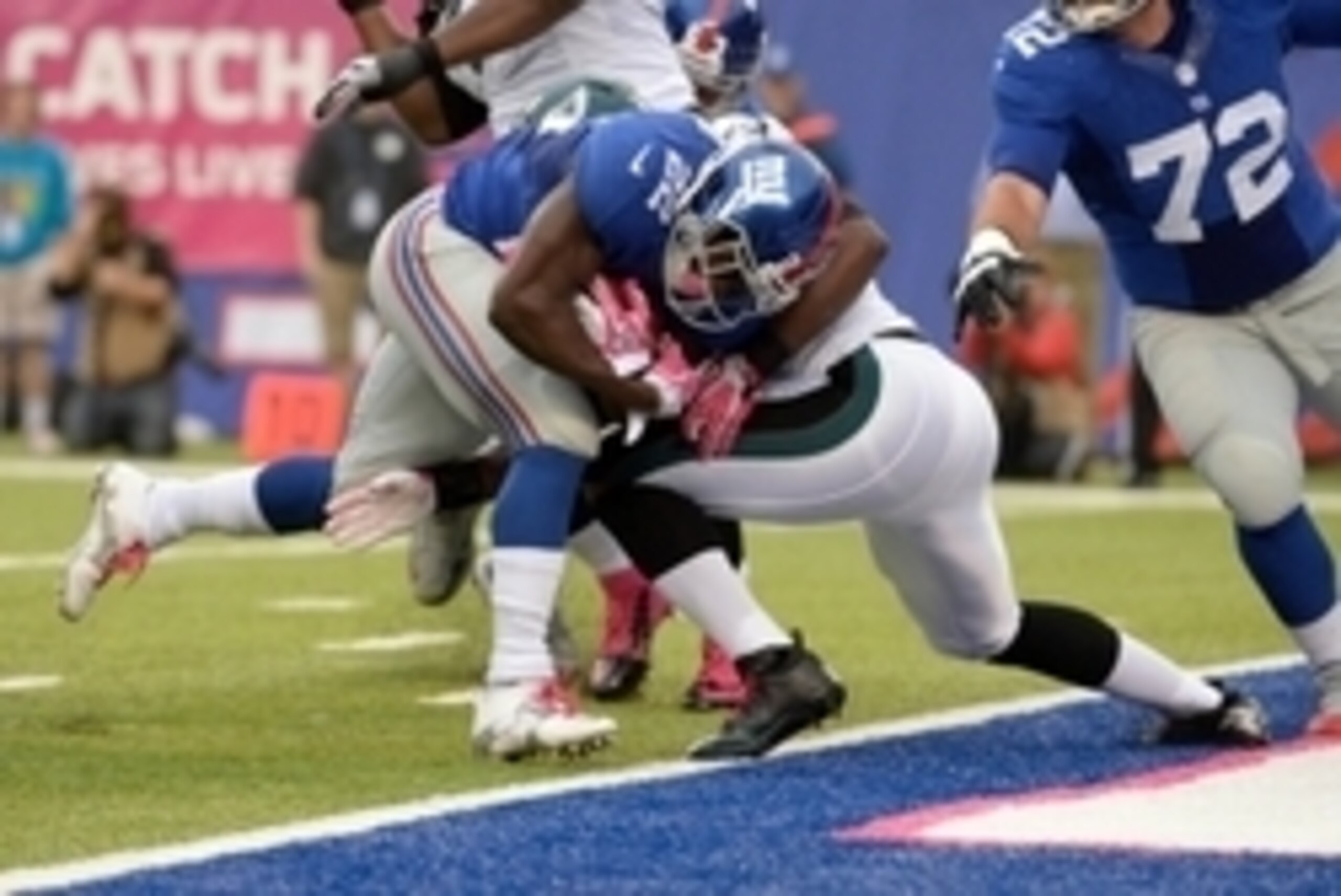 Oct 6, 2013; East Rutherford, NJ, USA; New York Giants running back David Wilson (22) scores a touchdown against the Philadelphia Eagles in the first quarter during the game at MetLife Stadium. Mandatory Credit: Robert Deutsch-USA TODAY Sports