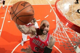 NEW YORK, NY - APRIL 13: Carlos Boozer #5 of the Chicago Bulls shoots against the New York Knicks at Madison Square Garden in New York City on April 13, 2014.  NOTE TO USER: User expressly acknowledges and agrees that, by downloading and or using this pho