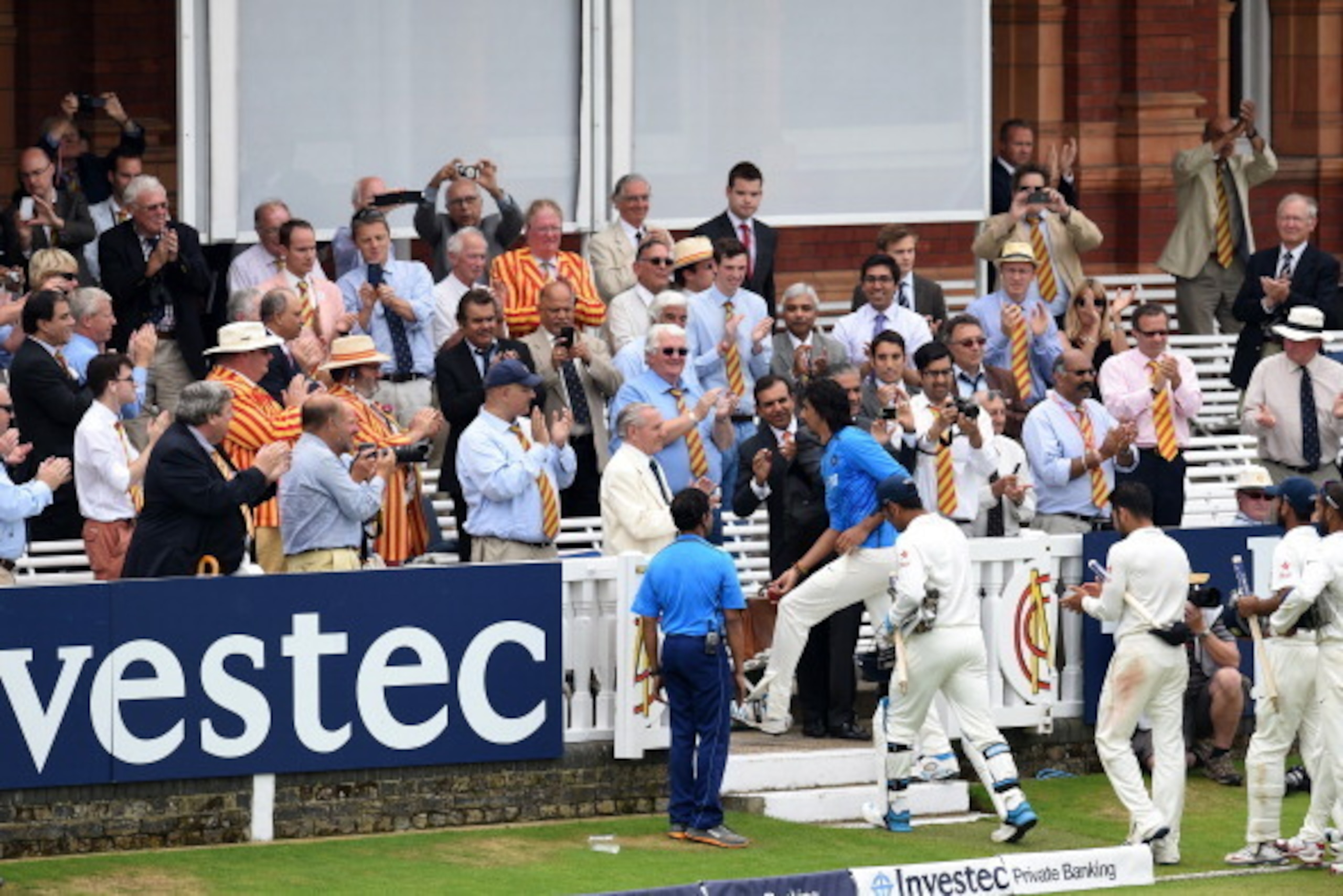 LONDON, ENGLAND - JULY 21:  India bowler Ishant Sharma (c) leads his team mates off through the MCC members after India win the test match during day five of 2nd Investec Test match between England and India at Lord's Cricket Ground on July 21, 2014 in Lo