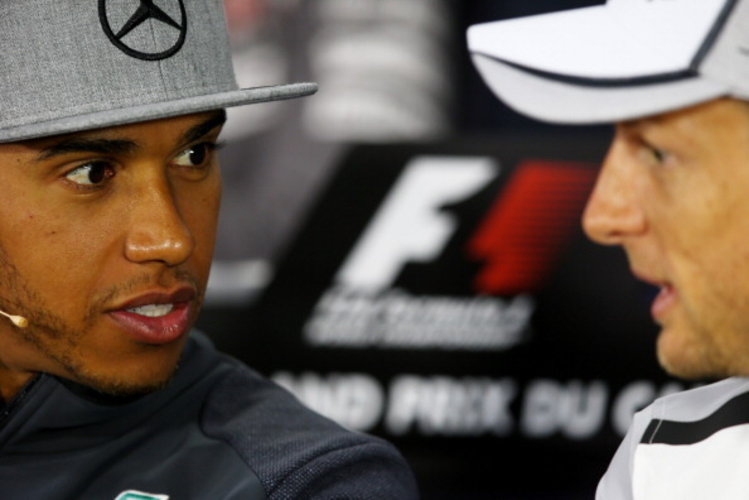 MONTREAL, QC - JUNE 05:  Lewis Hamilton of Great Britain and Mercedes GP and Jenson Button of Great Britain and McLaren attend a press conference ahead of the Canadian Formula One Grand Prix at Circuit Gilles Villeneuve on June 5, 2014 in Montreal, Canada