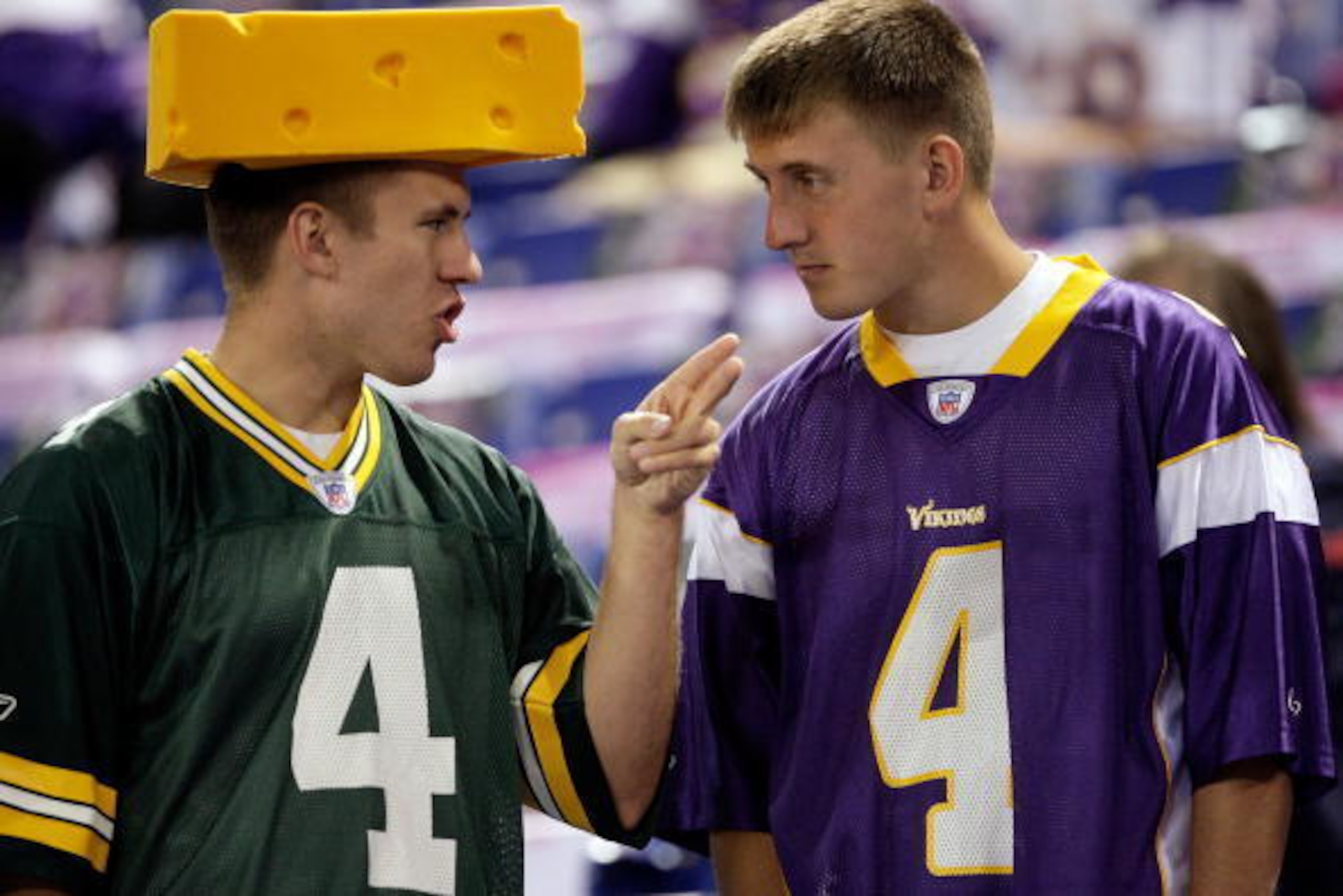 MINNEAPOLIS - OCTOBER 05:  Fans of Brett Favre #4  of the Minnesota Vikings talk prior to the start of the game against of the Green Bay Packers on October 5, 2009 at Hubert H. Humphrey Metrodome in Minneapolis, Minnesota.  (Photo by Jamie Squire/Getty Im