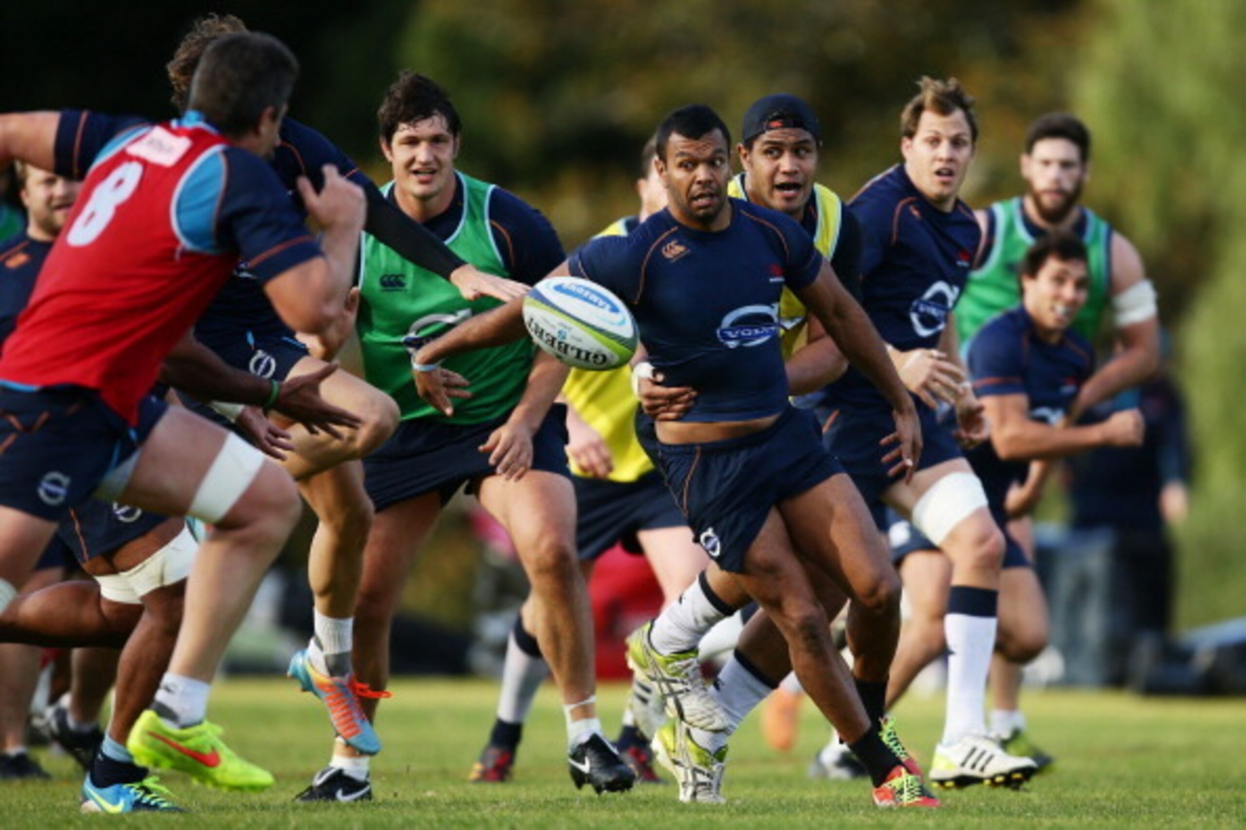 SYDNEY, AUSTRALIA - JULY 21:  Kurtley Beale of the Waratahs takes on the defence during a Waratahs Super Rugby training session at Moore Park on July 21, 2014 in Sydney, Australia.  (Photo by Matt King/Getty Images)