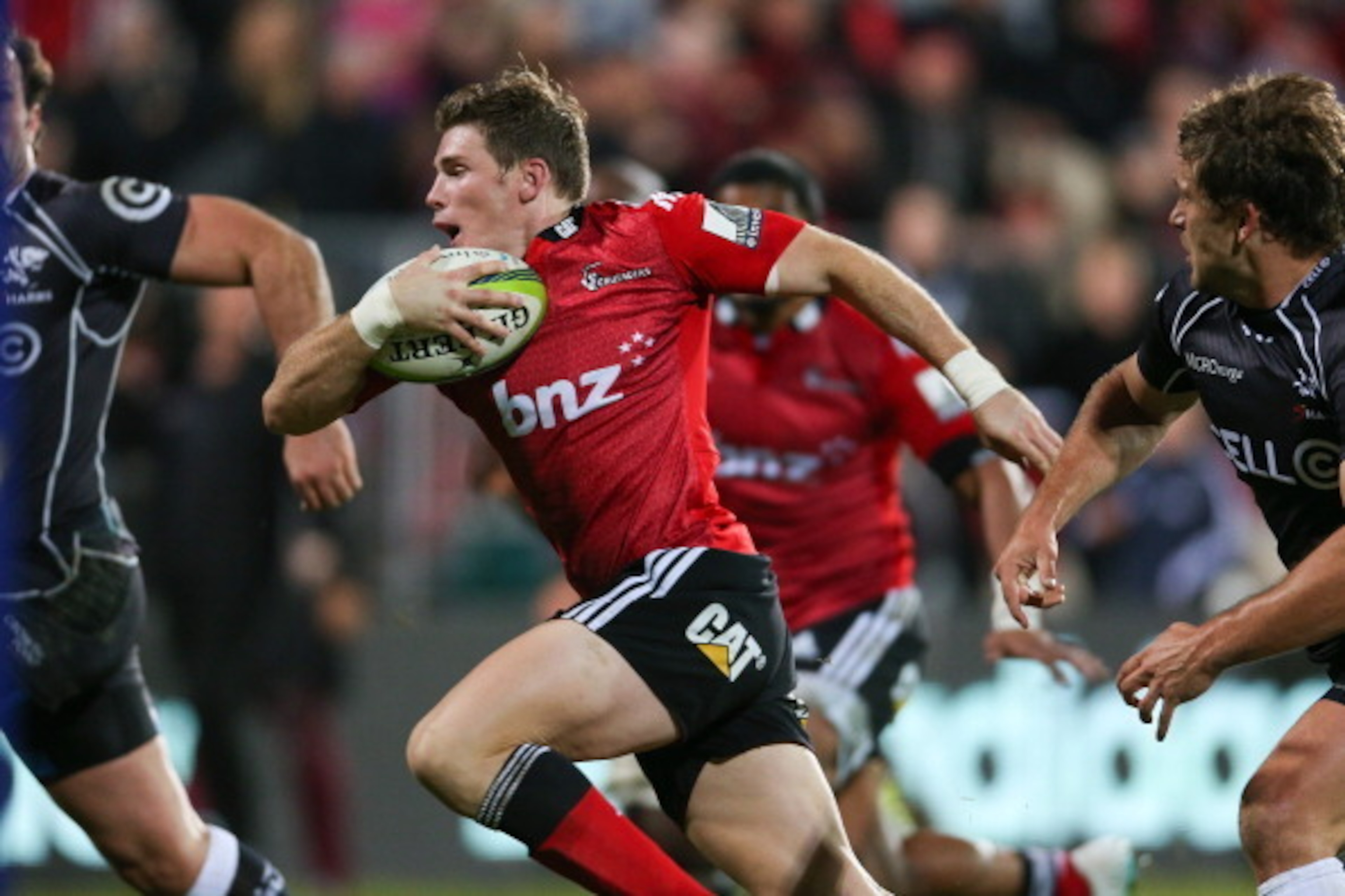 CHRISTCHURCH, NEW ZEALAND - MAY 17: Colin Slade of the Crusaders makes a break during the round 14 Super Rugby match between the Crusaders and the Sharks at AMI Stadium on May 17, 2014 in Christchurch, New Zealand.  (Photo by Martin Hunter/Getty Images)
