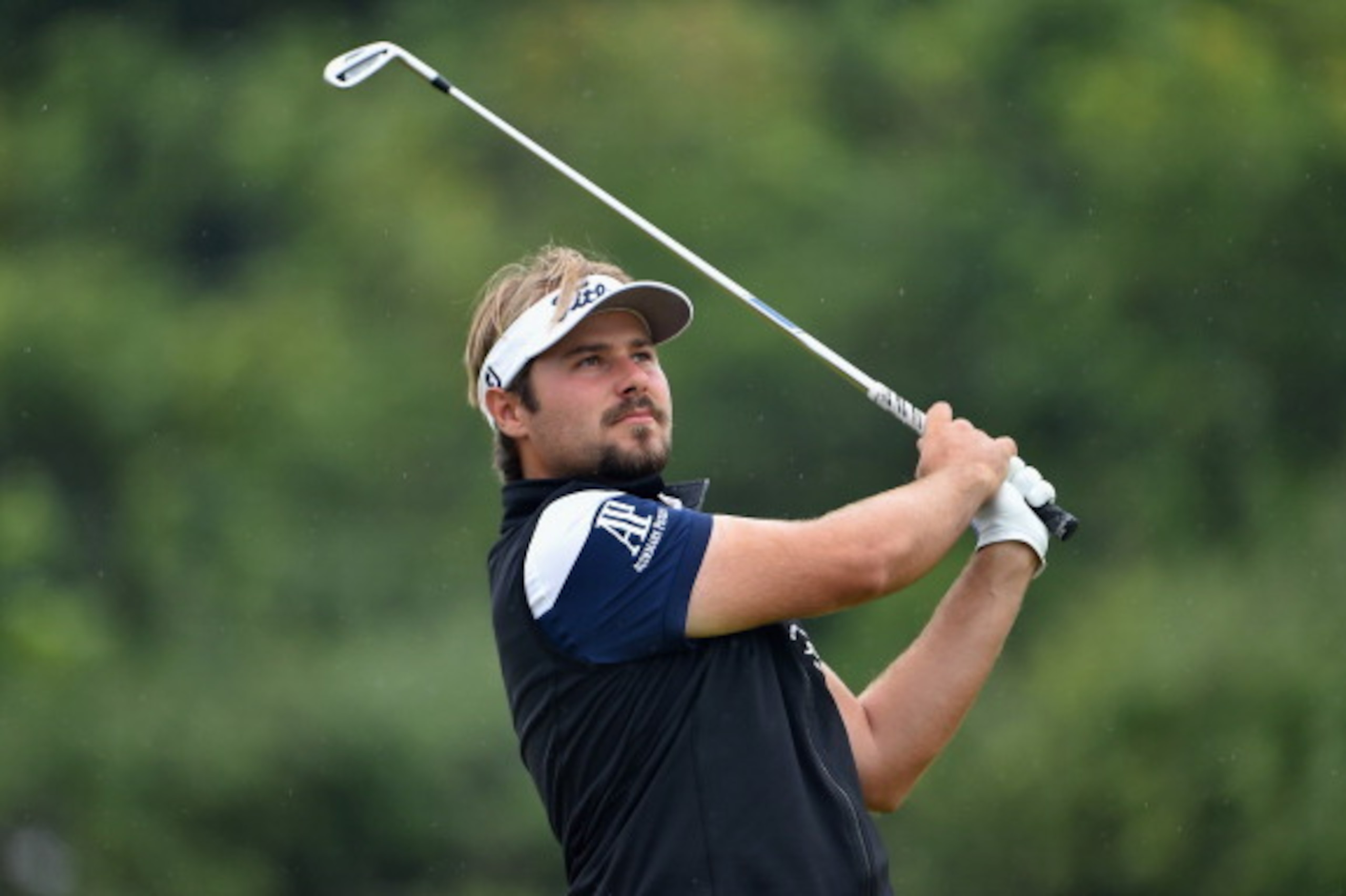 HOYLAKE, ENGLAND - JULY 19: Victor Dubuisson of France hits an approach during the third round of The 143rd Open Championship at Royal Liverpool on July 19, 2014 in Hoylake, England. (Photo by Stuart Franklin/Getty Images) HOYLAKE, ENGLAND - JULY 19: Victor Dubuisson of France hits an approach during the third round of The 143rd Open Championship at Royal Liverpool on July 19, 2014 in Hoylake, England. (Photo by Stuart Franklin/Getty Images)