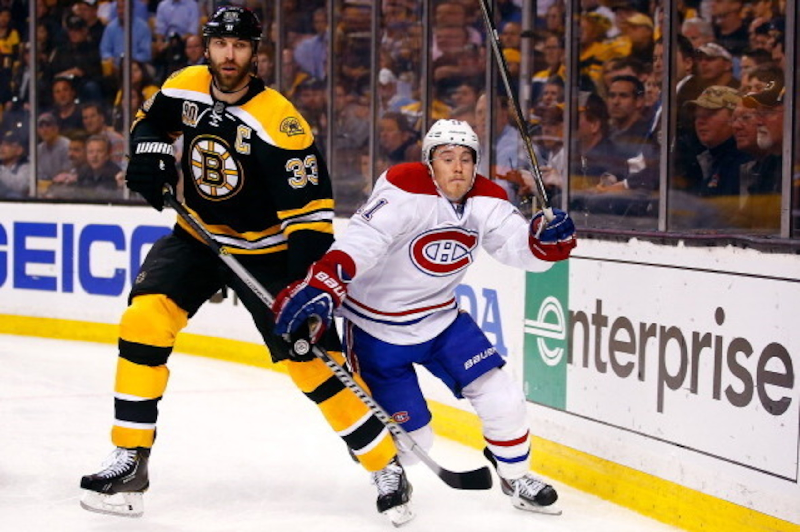 BOSTON, MA - MAY 14: Zdeno Chara #33 of the Boston Bruins and Brendan Gallagher #11 of the Montreal Canadiens battle behind the net during Game Seven of the Second Round of the 2014 NHL Stanley Cup Playoffs at the TD Garden on May 14, 2014 in Boston, Mass