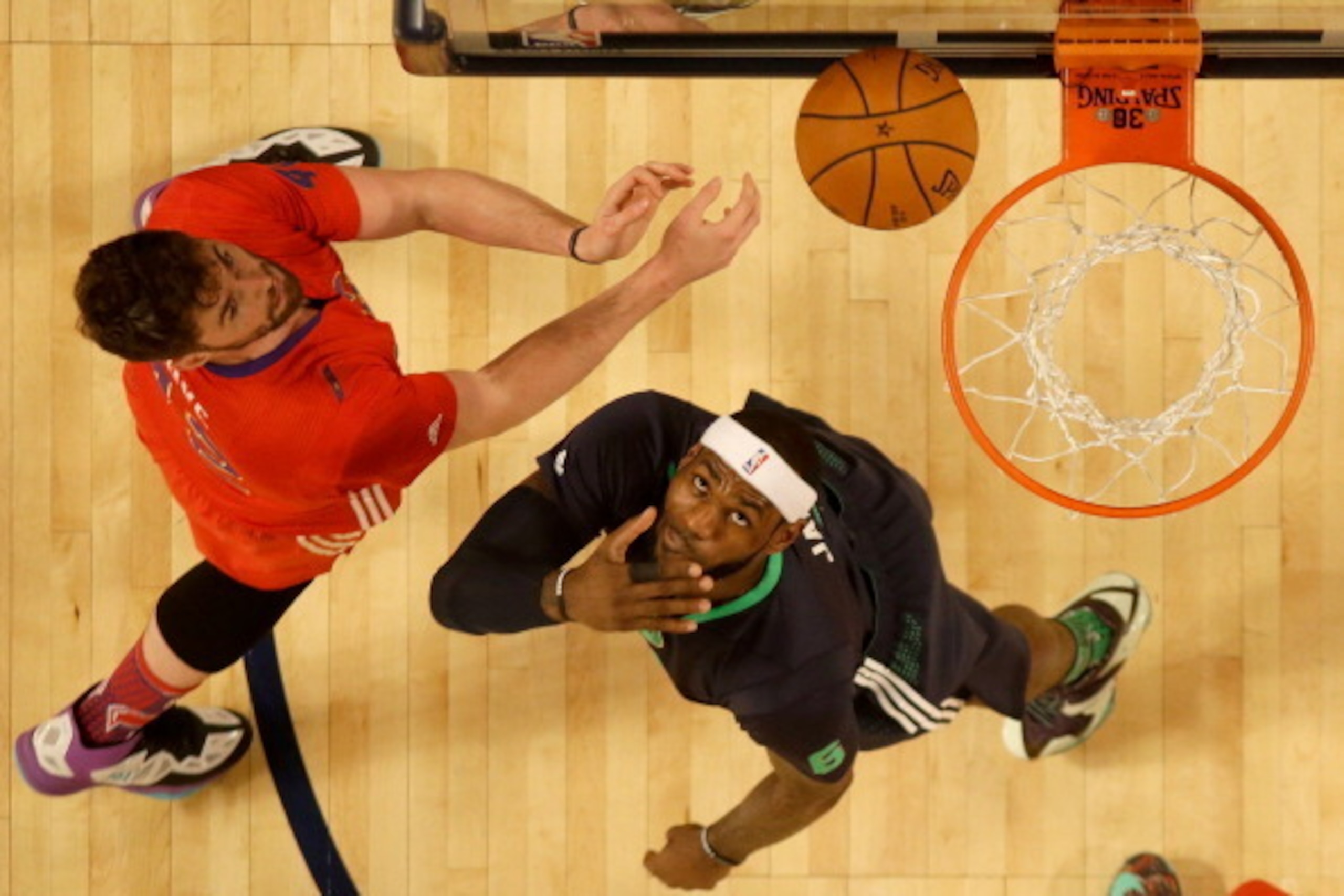 NEW ORLEANS, LA - FEBRUARY 16:  The Eastern Conference's LeBron James #6 of the Miami Heat takes a shot as the Western Conference's Kevin Love #42 of the Minnesota Timberwolves defends during 2014 NBA All-Star game at the Smoothie King Center on February 