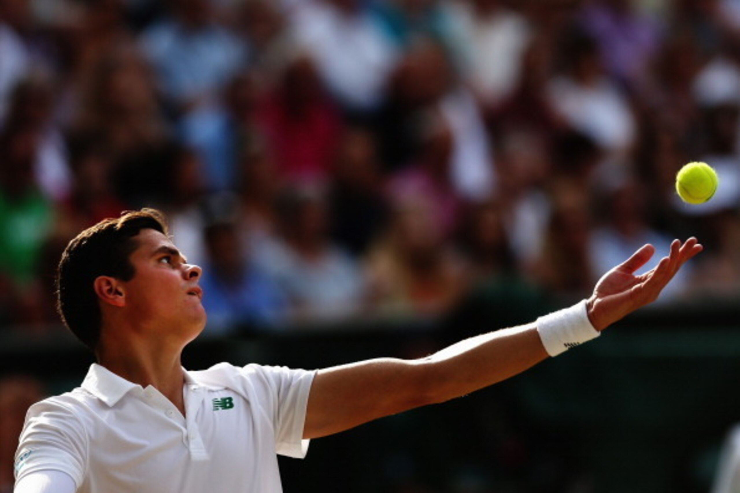 LONDON, ENGLAND - JULY 04:  Milos Raonic of Canada during his Gentlemen's Singles semi-final match against Roger Federer of Switzerland on day eleven of the Wimbledon Lawn Tennis Championships at the All England Lawn Tennis and Croquet Club on July 4, 201