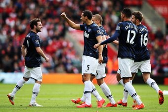SOUTHAMPTON, ENGLAND - MAY 11:  Juan Mata (L) of Manchester United celebrates with team mates after scoring during the Barclays Premier League match between Southampton and Manchester United at St Mary's Stadium on May 11, 2014 in Southampton, England.  (