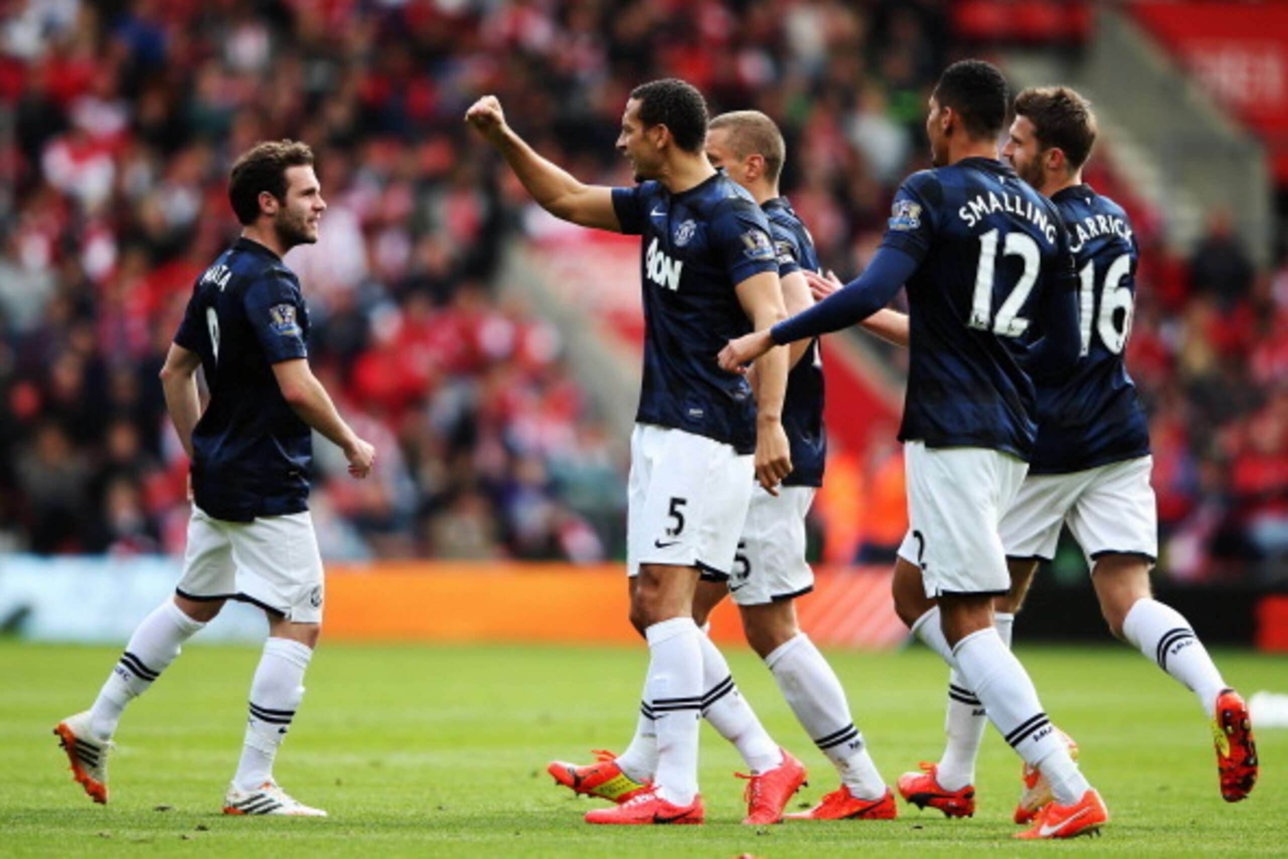 SOUTHAMPTON, ENGLAND - MAY 11:  Juan Mata (L) of Manchester United celebrates with team mates after scoring during the Barclays Premier League match between Southampton and Manchester United at St Mary's Stadium on May 11, 2014 in Southampton, England.  (