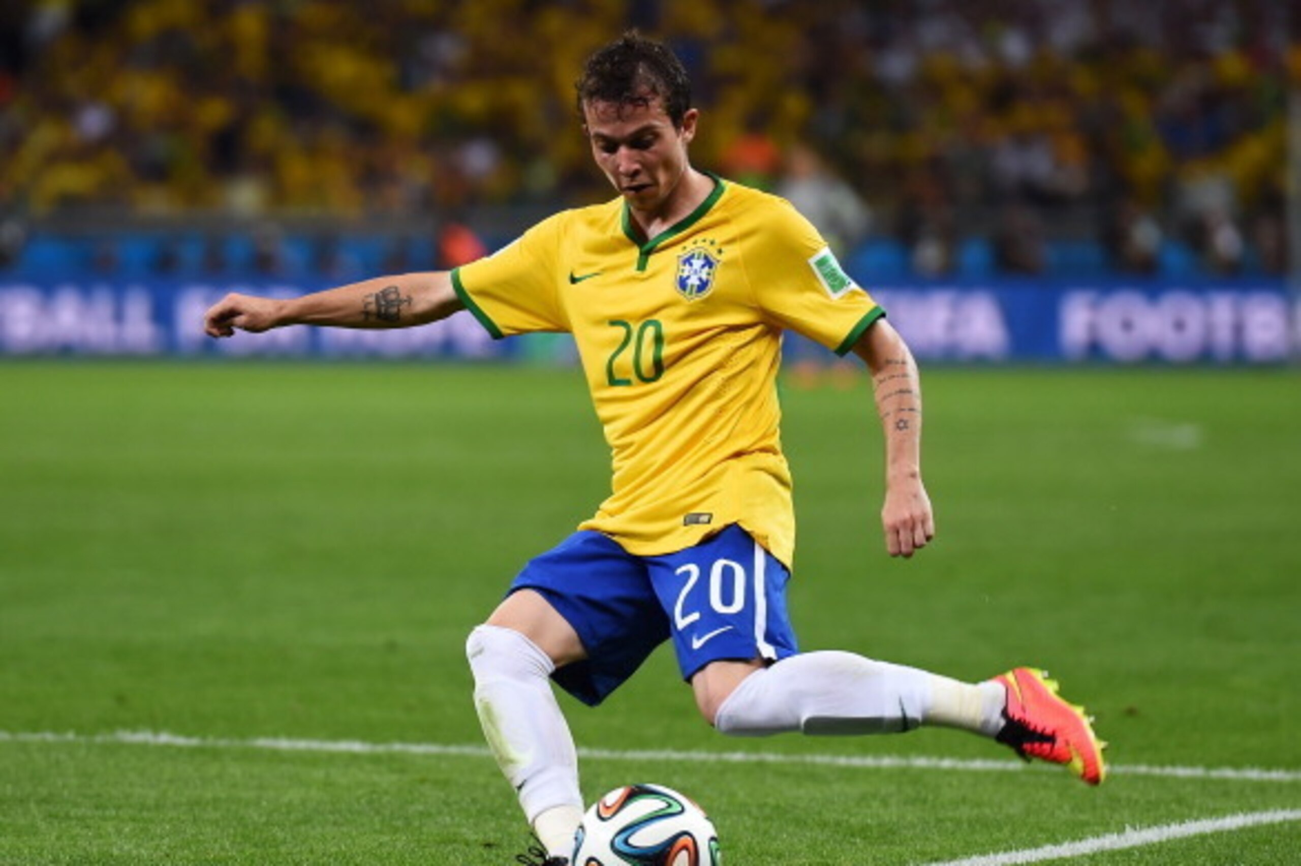 BELO HORIZONTE, BRAZIL - JULY 08: Bernard of Brazil strikes the ball during the 2014 FIFA World Cup Brazil Semi Final match between Brazil and Germany at Estadio Mineirao on July 8, 2014 in Belo Horizonte, Brazil.  (Photo by Buda Mendes/Getty Images)