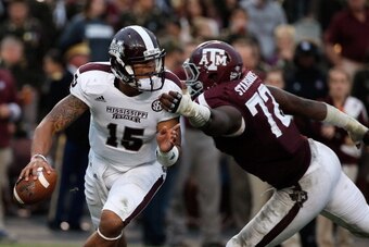 COLLEGE STATION, TX - NOVEMBER 09:  Gavin Stansbury #72 of the Texas A&M Aggies chases after Dak Prescott #15 of the Mississippi State Bulldogs in the third quarter at Kyle Field on November 9, 2013 in College Station, Texas.  (Photo by Scott Halleran/Get