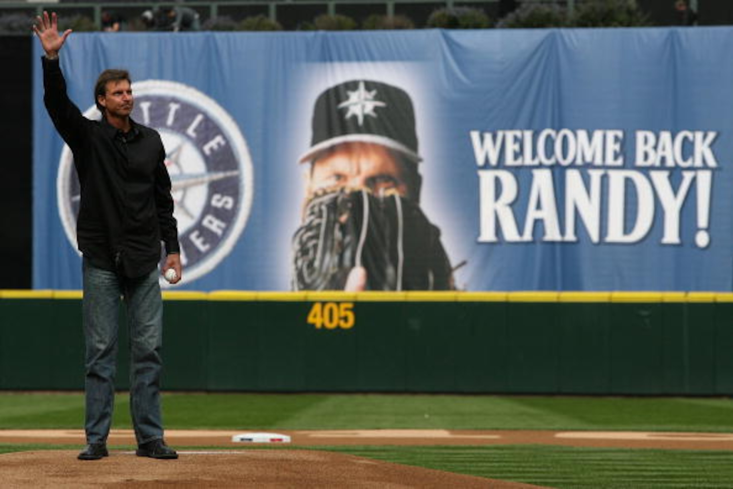 SEATTLE - APRIL 12:  Former Mariners star Randy Johnson waves to the crowd prior to throwing out the ceremonial first pitch before the Mariners' home opener against the Oakland Athletics at Safeco Field on April 12, 2010 in Seattle, Washington. (Photo by 