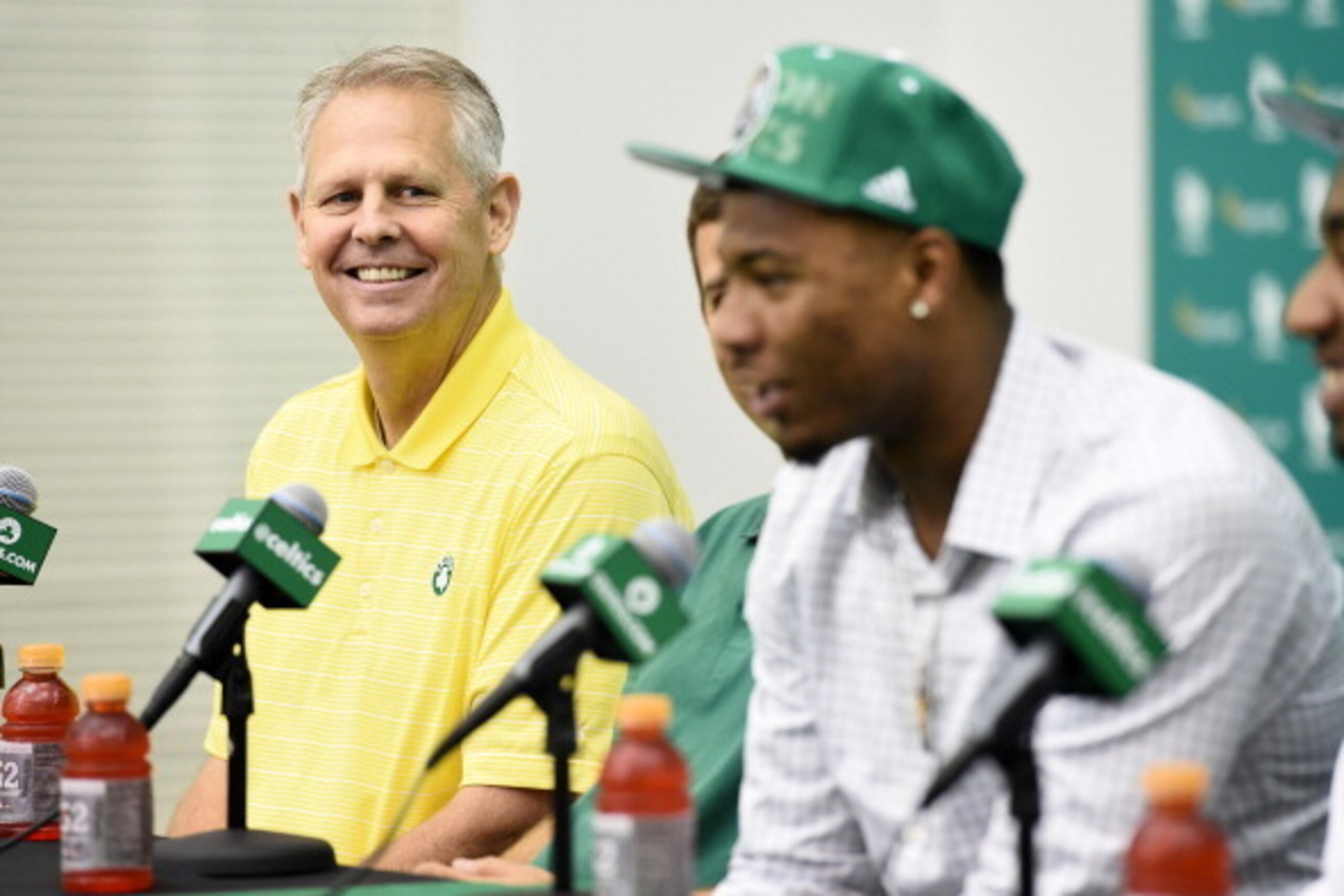 WALTHAM, MA - JUNE 30:  Danny Ainge listens to Marcus Smart speak to the media during a press conference on June 30, 2014 at the Boston Celtics Training Center in Waltham, Massachusetts . NOTE TO USER: User expressly acknowledges and agrees that, by downl