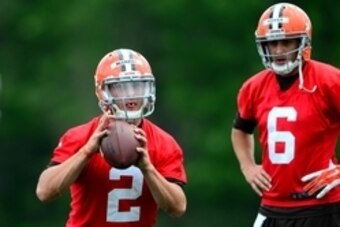 Jun 12, 2014; Berea, OH, USA; Cleveland Browns quarterback Johnny Manziel (2) looks to pass as Brian Hoyer (6) looks on during minicamp at Browns training facility. Mandatory Credit: Andrew Weber-USA TODAY Sports
