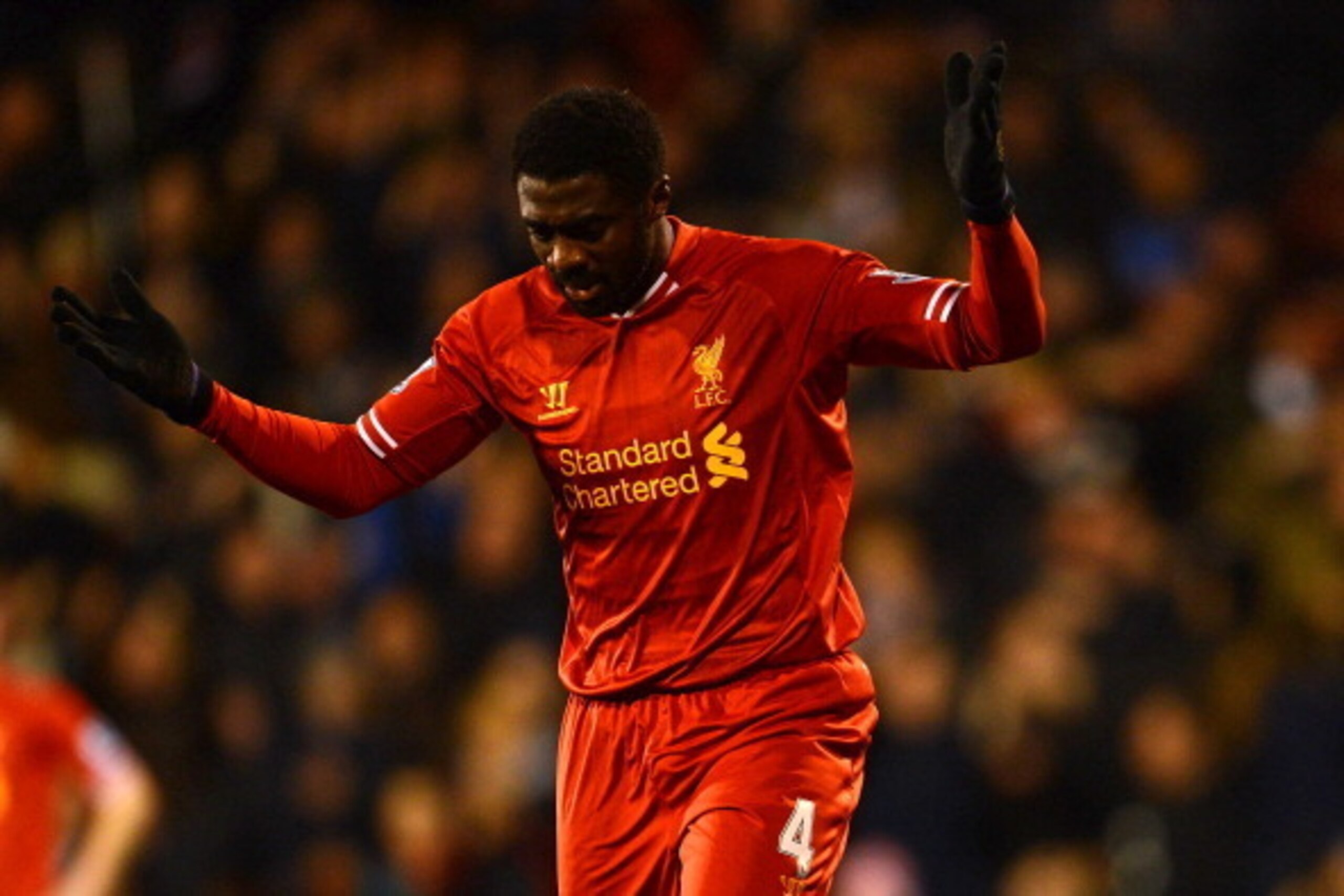 LONDON, ENGLAND - FEBRUARY 12:  Kolo Toure of Liverpool reacts after he scored an own goal during the Barclays Premier League match between Fulham and Liverpool at Craven Cottage on February 12, 2014 in London, England.  (Photo by Mike Hewitt/Getty Images