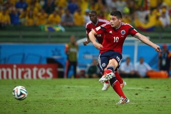 FORTALEZA, BRAZIL - JULY 04:  James Rodriguez of Colombia shoots and scores his team's first goal on a penalty kick during the 2014 FIFA World Cup Brazil Quarter Final match between Brazil and Colombia at Castelao on July 4, 2014 in Fortaleza, Brazil.  (P