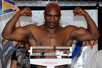 LAS VEGAS - APRIL 09:  Boxer Evander Holyfield poses on the scale during the official weigh-in for his bout against Francois Botha at the Thomas & Mack Center April 9, 2010 in Las Vegas, Nevada. The two will meet in a heavyweight bout on April 10 in Las V