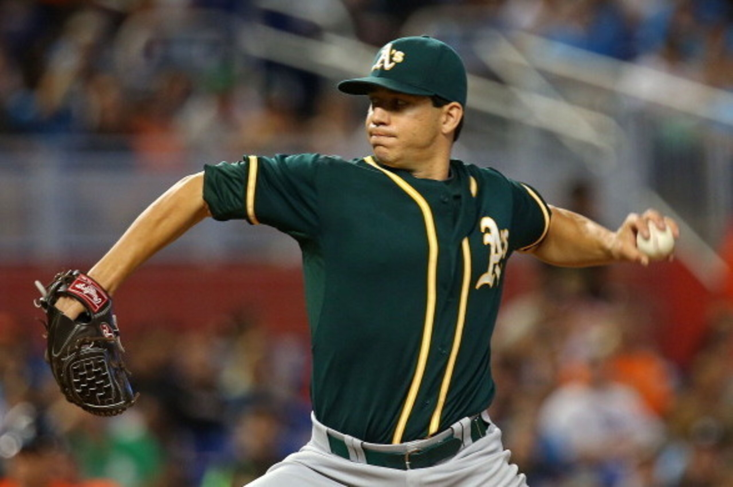 MIAMI, FL - JUNE 29:  Tommy Milone #57 of the Oakland Athletics pitches during a game against the Miami Marlins at Marlins Park on June 29, 2014 in Miami, Florida.  (Photo by Mike Ehrmann/Getty Images)