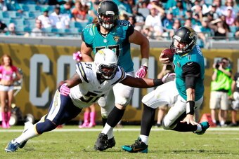 JACKSONVILLE, FL - OCTOBER 20:  Chad Henne #7 of the Jacksonville Jaguars is sacked by  Larry English #51 of the San Diego Chargers during the game at EverBank Field on October 20, 2013 in Jacksonville, Florida.  (Photo by Sam Greenwood/Getty Images)