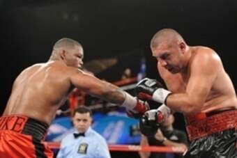 Nov 2, 2013; New York, NY, USA; Mike Perez (red trunks) and Magomed Abdusalamov (black trunks) box during their heavyweight US NBC Champoinship bout at The Theater at Madison Square Garden. Perez won via unanimous decision. Mandatory Credit: Joe Camporeal