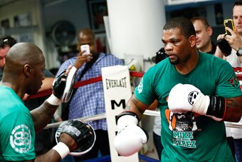 Mike Perez works with a sparring partner on Tuesday in New York City.