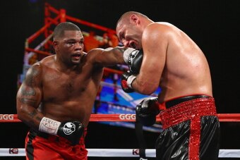 NEW YORK, NY - NOVEMBER 02:  Mike Perez punches  Magomed Abdusalamov during their Heavyweight fight at The Theater at Madison Square Garden on November 2, 2013 in New York City.  (Photo by Al Bello/Getty Images)