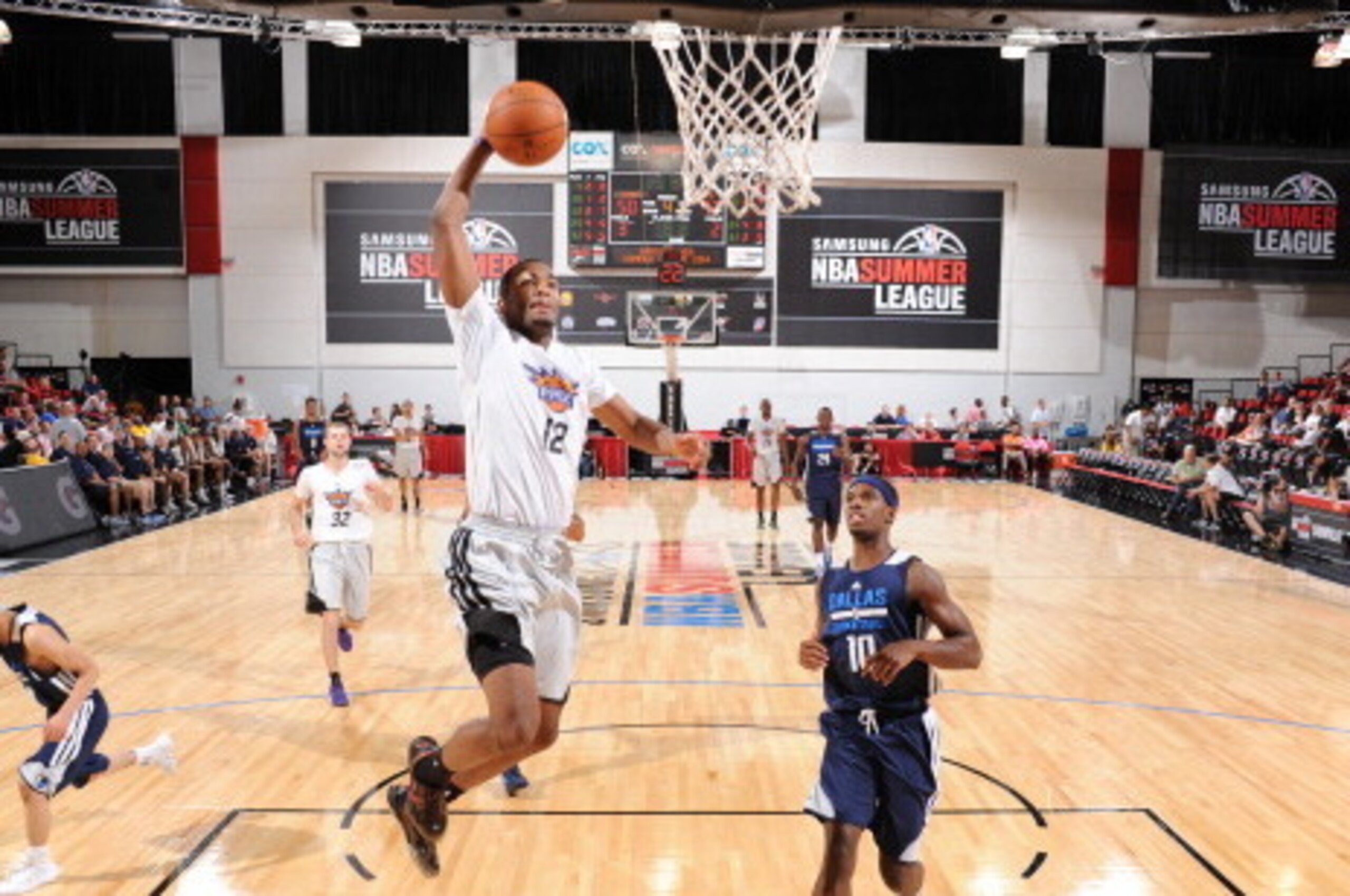 LAS VEGAS, NV - JULY 18: T.J. Warren #12 of the Phoenix Suns dunks against the Dallas Mavericks on July 18, 2014 at the Cox Pavilion in Las Vegas, Nevada. NOTE TO USER: User expressly acknowledges and agrees that, by downloading and or using this photogra LAS VEGAS, NV - JULY 18: T.J. Warren #12 of the Phoenix Suns dunks against the Dallas Mavericks on July 18, 2014 at the Cox Pavilion in Las Vegas, Nevada. NOTE TO USER: User expressly acknowledges and agrees that, by downloading and or using this photogra