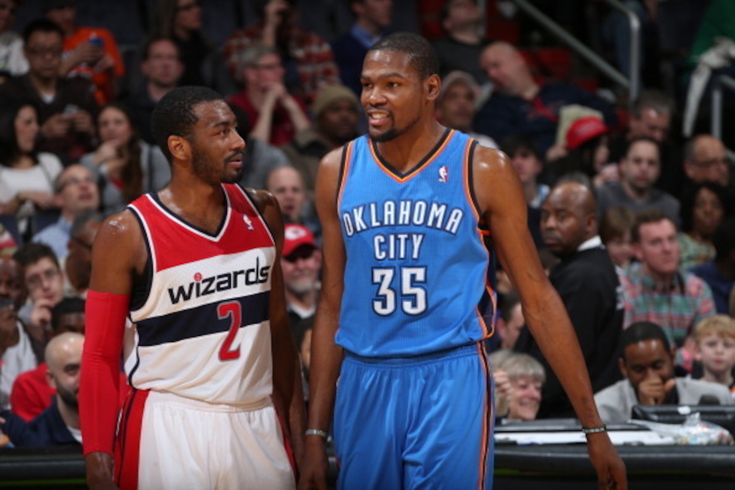 WASHINGTON, DC - FEBRUARY 2: John Wall #2 of the Washington Wizards talks with Kevin Durant #35 of the Oklahoma City Thunder during the game at the Verizon Center on February 2, 2014 in Washington, DC. NOTE TO USER: User expressly acknowledges and agrees