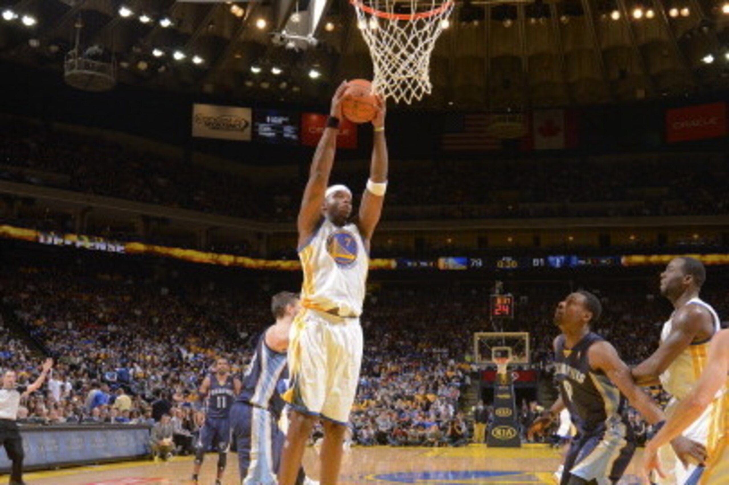 OAKLAND, CA - MARCH 28: Jermaine O'Neal #7 of the Golden State Warriors rebounds against the Memphis Grizzlies on March 28, 2014 at Oracle Arena in Oakland, California. NOTE TO USER: User expressly acknowledges and agrees that, by downloading and or using