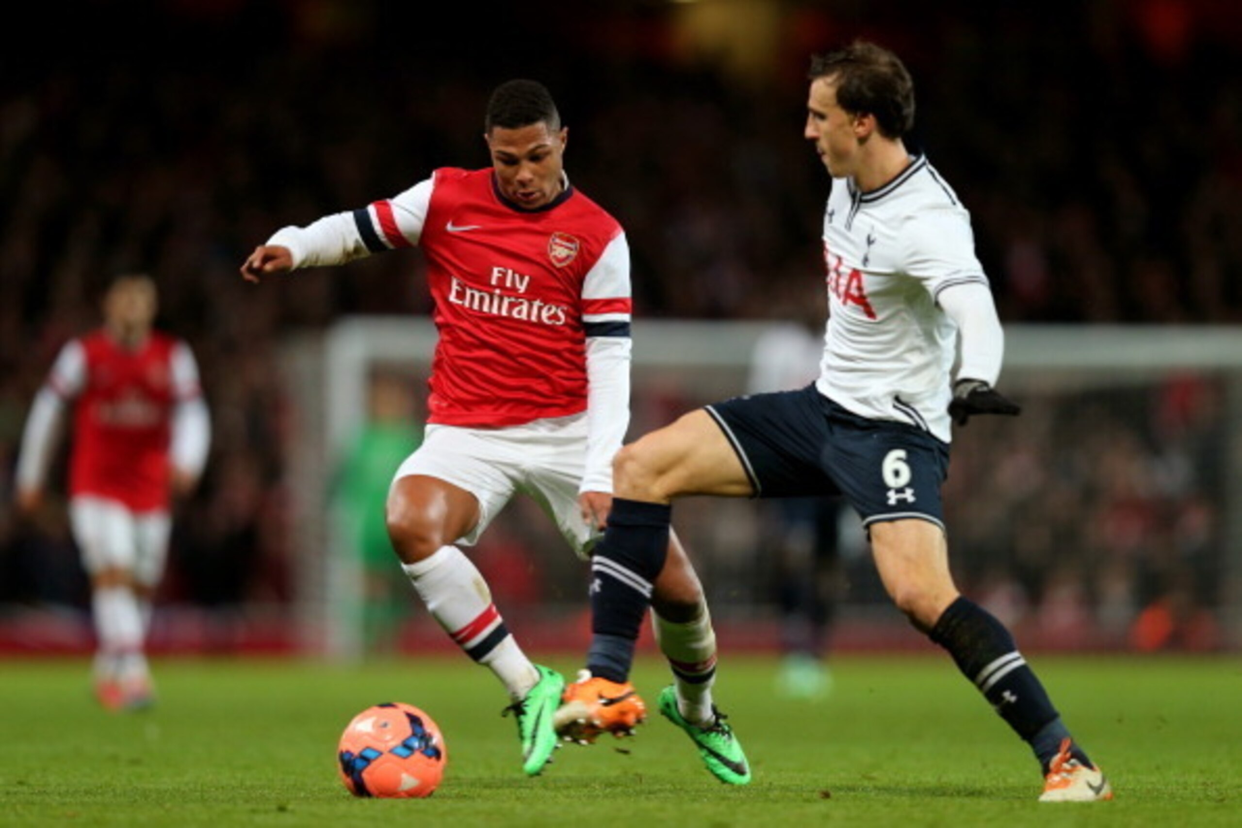 LONDON, ENGLAND - JANUARY 04: Serge Gnabry of Arsenal and Vlad Chiriches of Spurs compete for the ball during the Budweiser FA Cup third round match between Arsenal and Tottenham Hotspur at Emirates Stadium on January 4, 2014 in London, England. (Photo LONDON, ENGLAND - JANUARY 04: Serge Gnabry of Arsenal and Vlad Chiriches of Spurs compete for the ball during the Budweiser FA Cup third round match between Arsenal and Tottenham Hotspur at Emirates Stadium on January 4, 2014 in London, England. (Photo