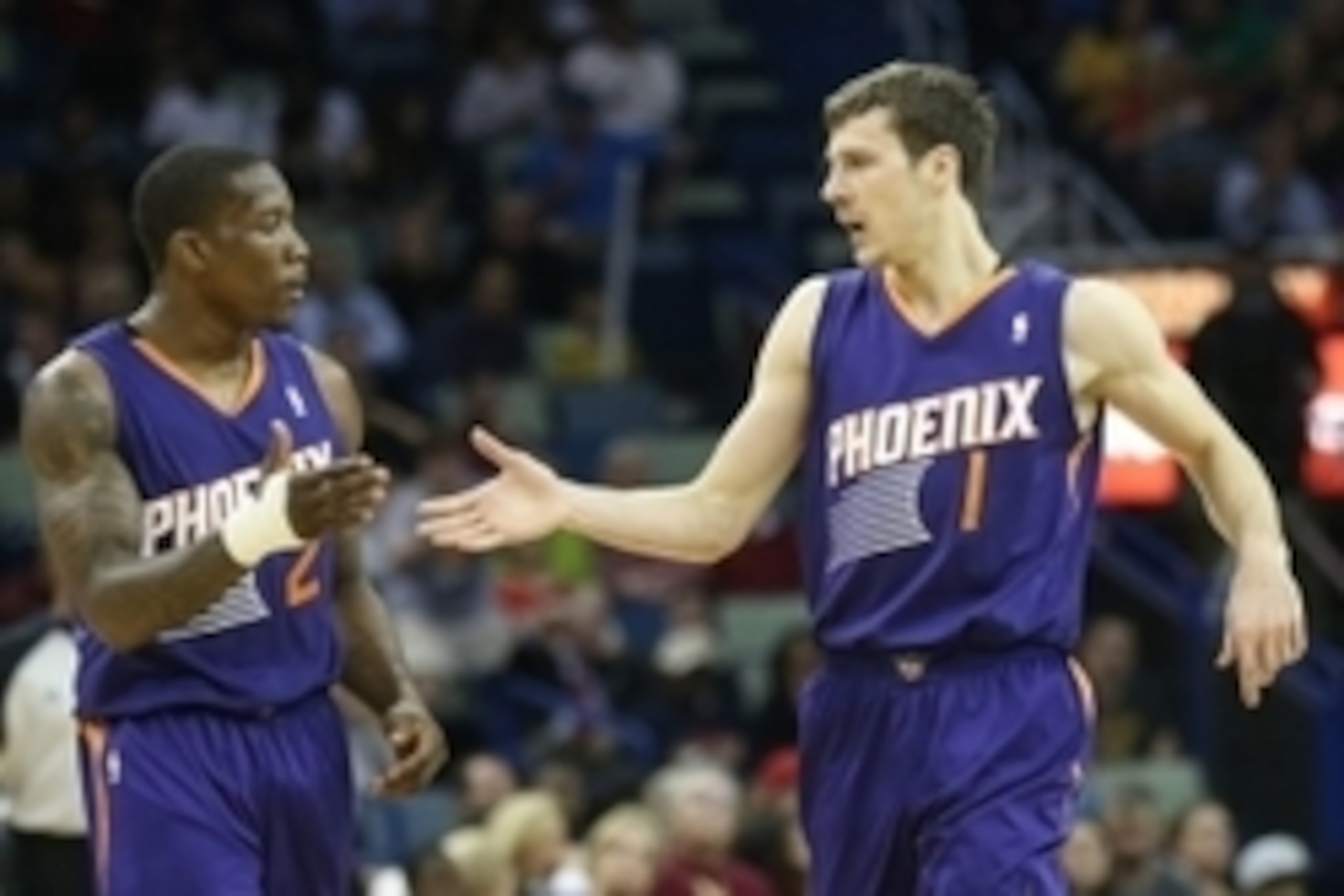 Apr 9, 2014; New Orleans, LA, USA; Phoenix Suns guard Eric Bledsoe (2) celebrates with guard Goran Dragic (1) against the New Orleans Pelicans in the second half at the Smoothie King Center. The Suns won 94-88. Mandatory Credit: Crystal LoGiudice-USA TODA