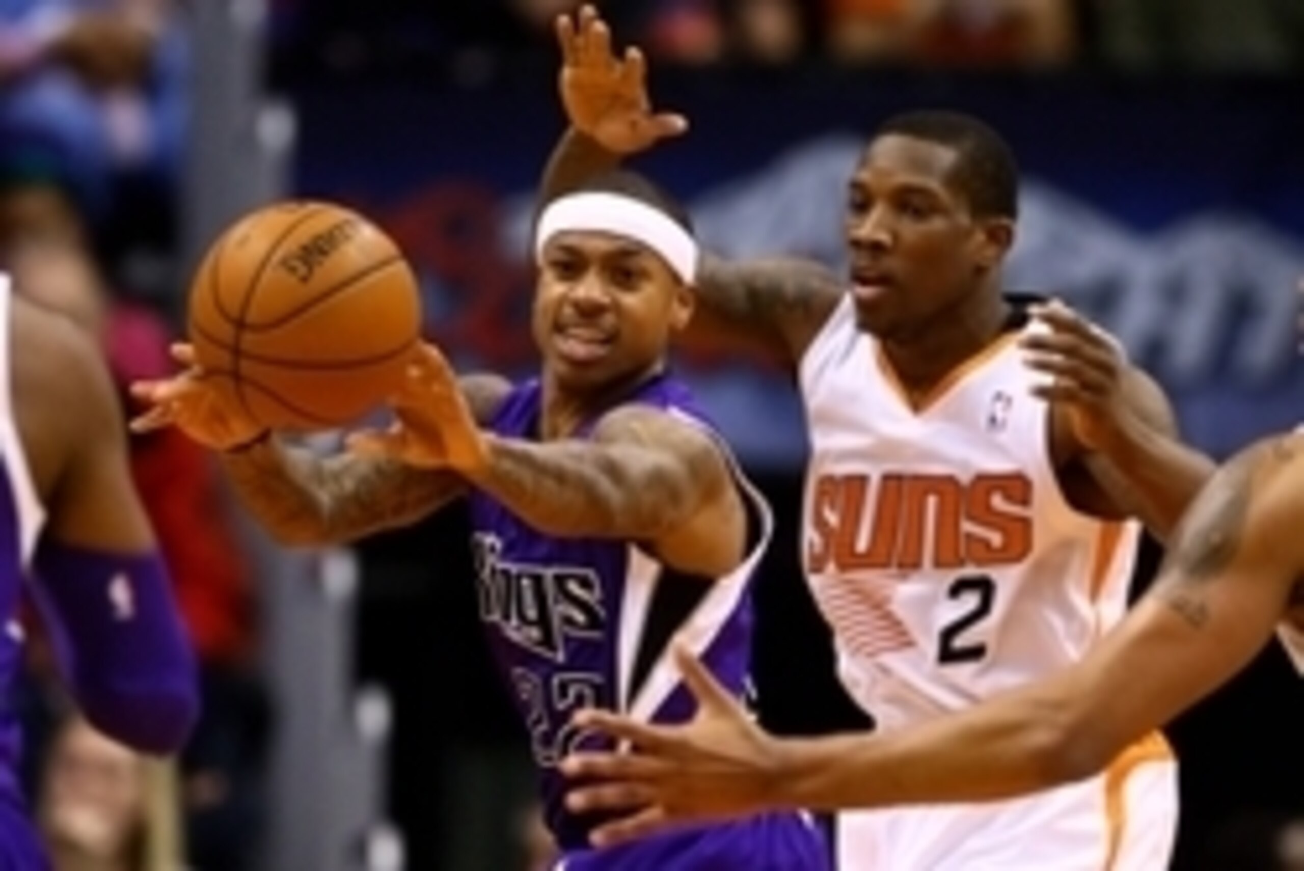 Dec 13, 2013; Phoenix, AZ, USA; Sacramento Kings guard Isaiah Thomas (left) passes the ball against Phoenix Suns  guard Eric Bledsoe at US Airways Center. The Suns defeated the Kings 116-107. Mandatory Credit: Mark J. Rebilas-USA TODAY Sports