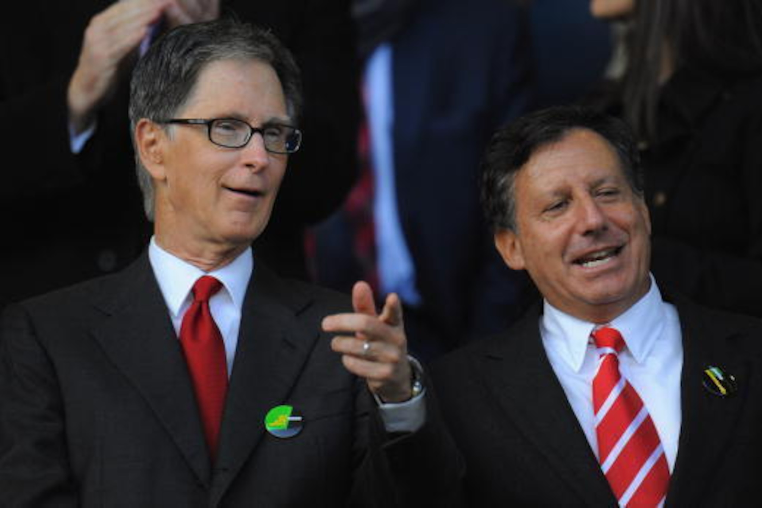LIVERPOOL, ENGLAND - OCTOBER 17: New Liverpool co-owners John W Henry (L) and NESV Chairman Tom Werner look on during the Barclays Premier League match between Everton and Liverpool at Goodison Park on October 17, 2010 in Liverpool, England.  (Photo by Mi