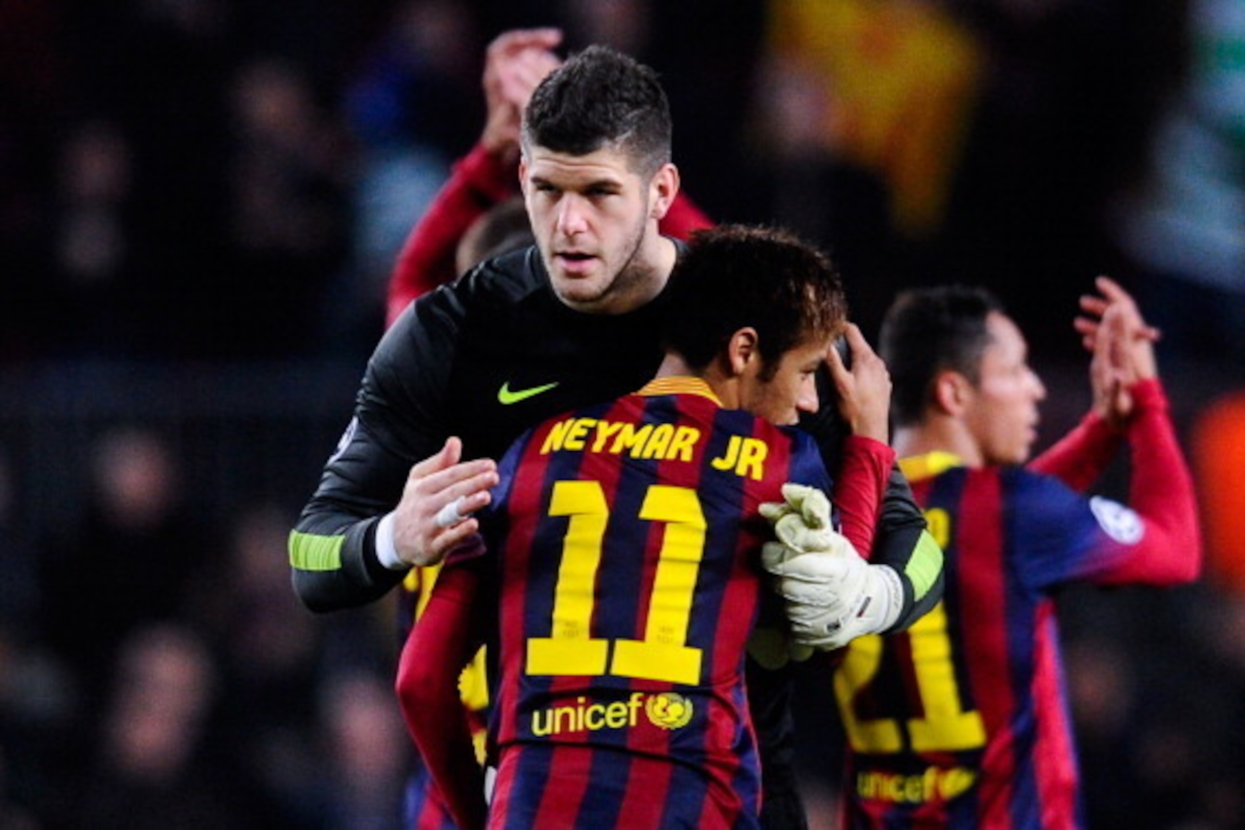 BARCELONA, SPAIN - DECEMBER 11:  Fraser Forster of Celtic FC hugs Neymar of FC Barcelona at the end of the Champions League Group H match between FC Barcelona and Celtic FC at Camp Nou on December 11, 2013 in Barcelona, Spain.  (Photo by David Ramos/Getty
