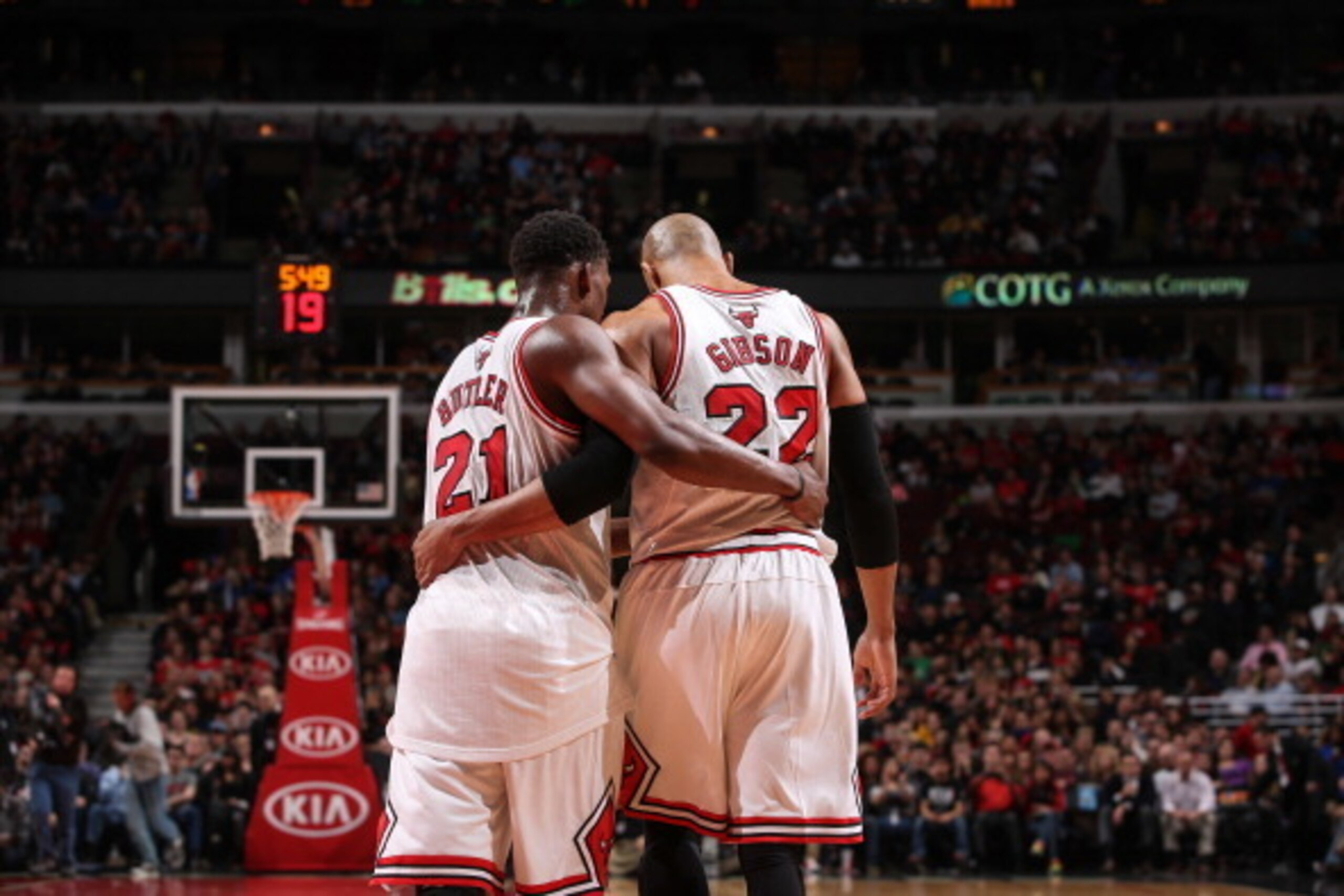 CHICAGO, IL - APRIL 4: Jimmy Butler #21 and Taj Gibson #22 of the Chicago Bulls share a word during the game against the Milwaukee Bucks on April 04, 2014 at the United Center in Chicago, Illinois. NOTE TO USER: User expressly acknowledges and agrees that