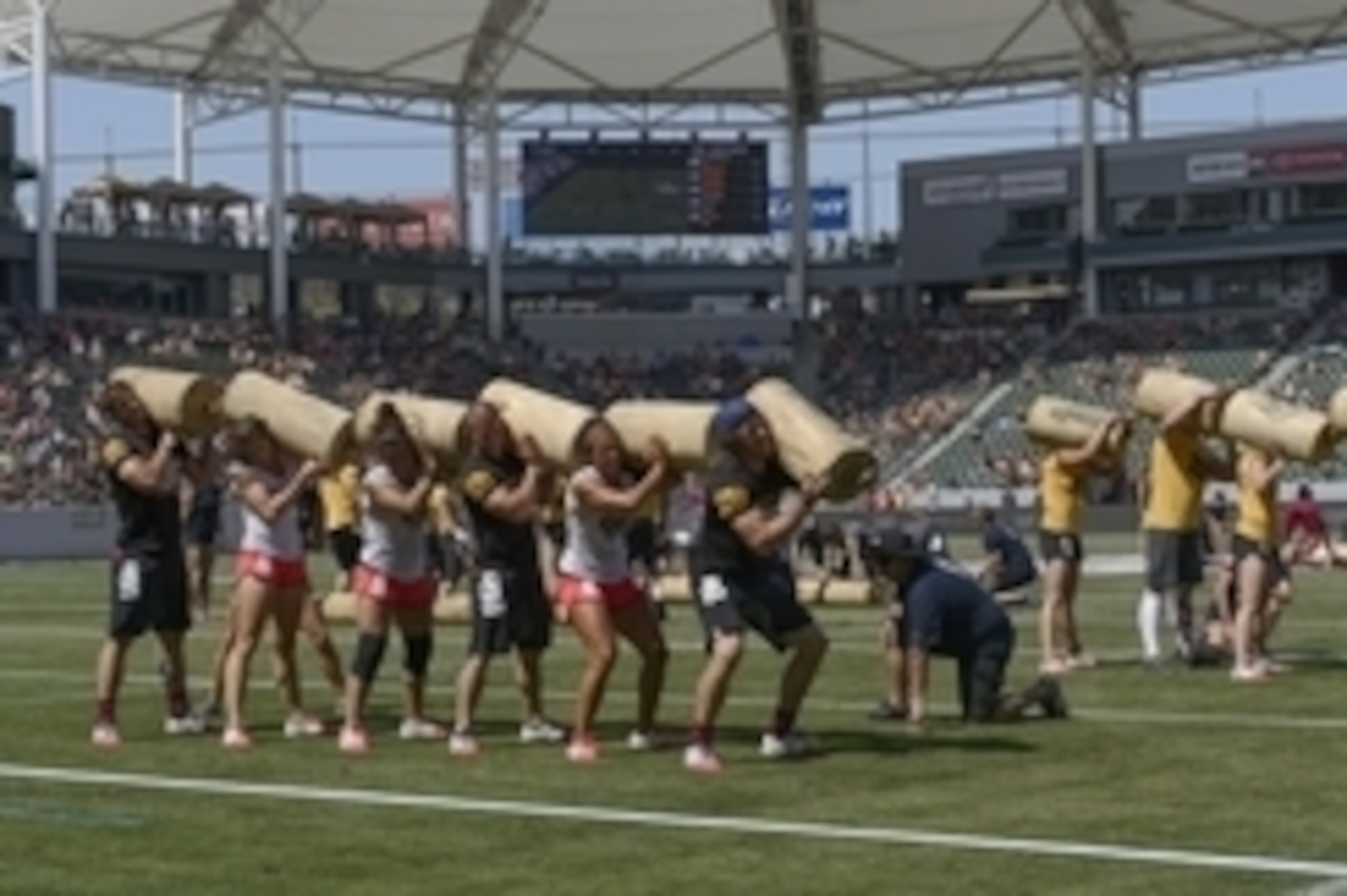 Jul 27, 2013; Carson, CA, USA; Competitors participate in the team squat burpee event during the the CrossFit Games at the StubHub Center. Mandatory Credit: Kelvin Kuo-USA TODAY Sports