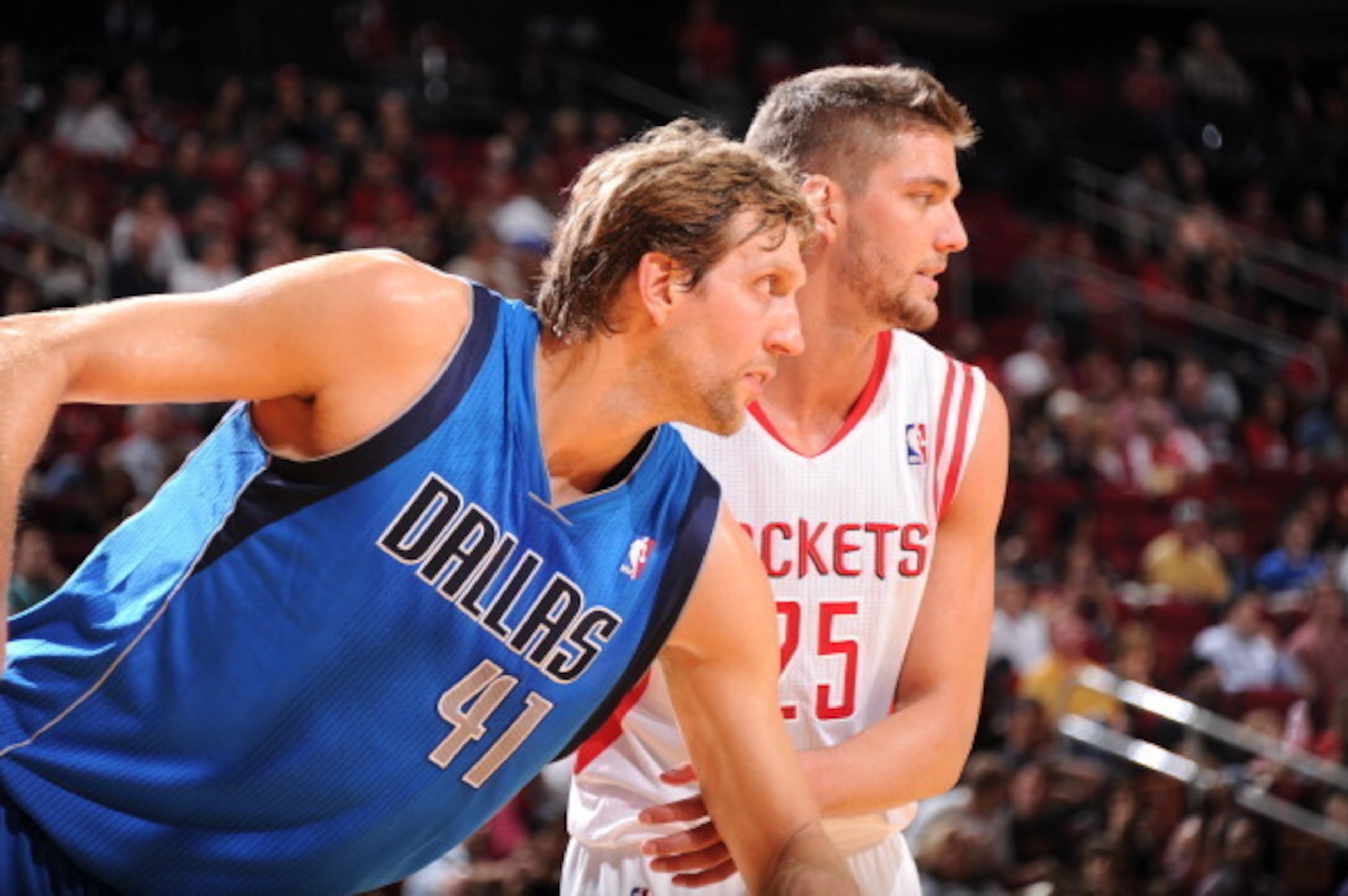 HOUSTON, TX - NOVEMBER 1:  Dirk Nowitzki #41 of the Dallas Mavericks and Chandler Parsons #25 of the Houston Rockets battle for the rebound on November 1, 2013 at the Toyota Center in Houston, Texas. NOTE TO USER: User expressly acknowledges and agrees th