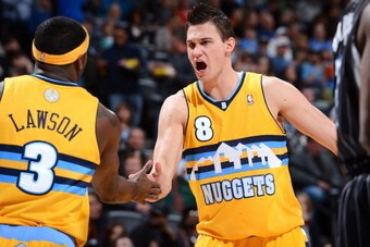 DENVER, CO - JANUARY 9:  Ty Lawson #3 of the Denver Nuggets and Danilo Gallinari #8 of the Denver Nuggets celebrate during the game between the Orlando Magic and the Denver Nuggets on January 9, 2013 at the Pepsi Center in Denver, Colorado. NOTE TO USER: 