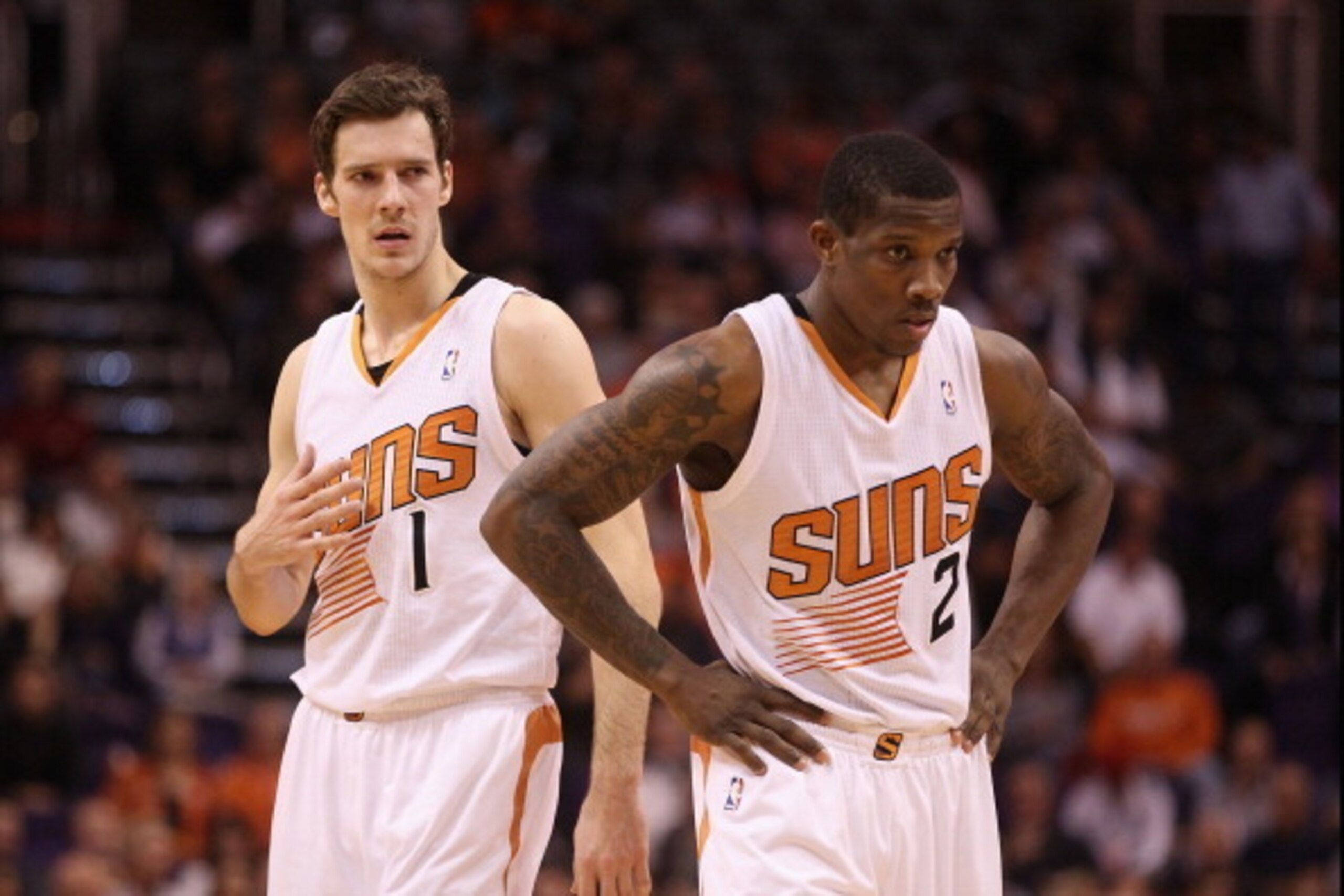 PHOENIX, AZ - DECEMBER 18:  Goran Dragic #1 and Eric Bledsoe #2 of the Phoenix Suns await a free throw shot during the NBA game against the San Antonio Spurs at US Airways Center on December 18, 2013 in Phoenix, Arizona. The Spurs defeated the 108-101.  N