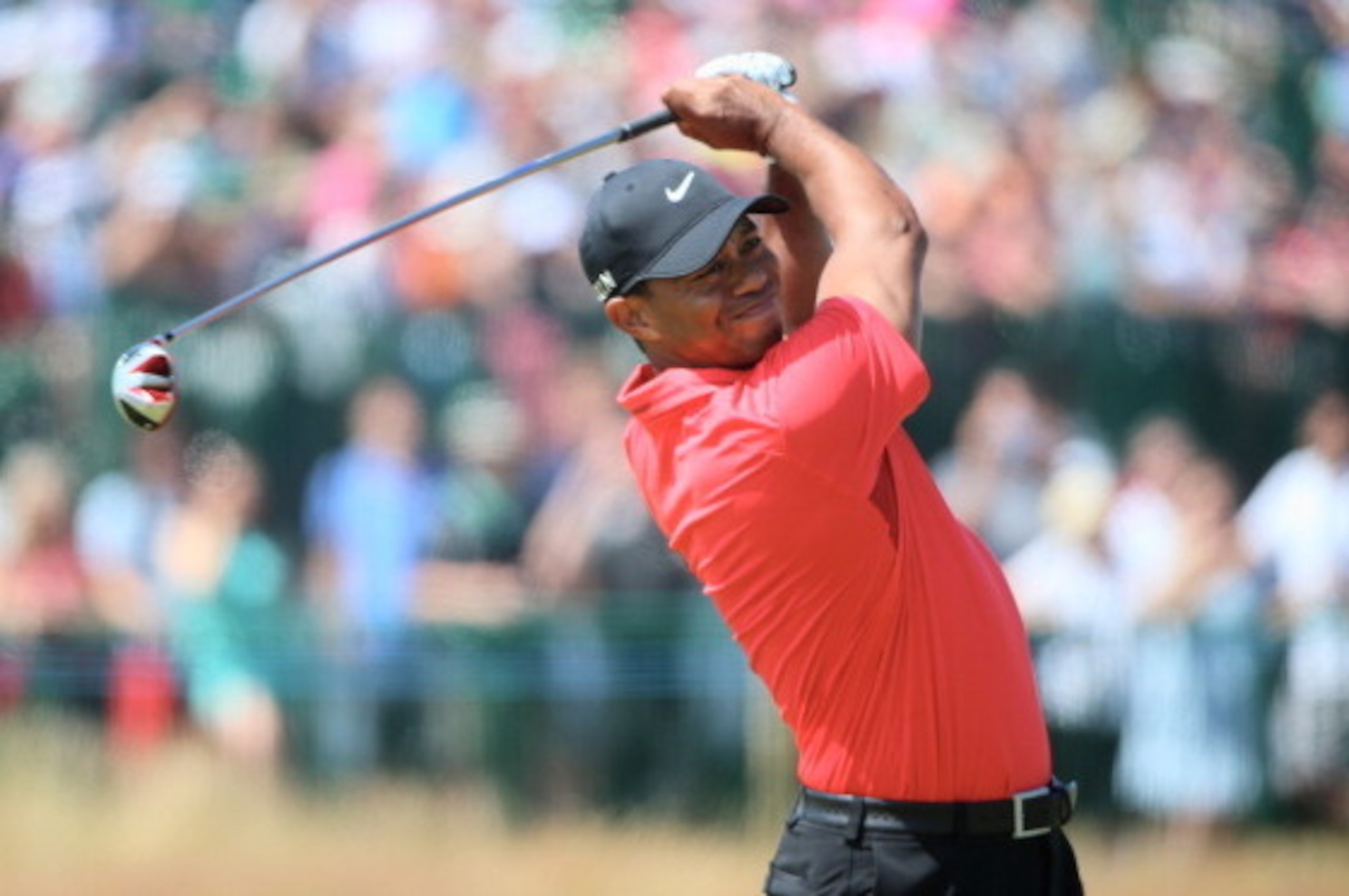 HOYLAKE, ENGLAND - JULY 20:  Tiger Woods of the United States hits his second shot on the 18th hole during the final round of The 143rd Open Championship at Royal Liverpool on July 20, 2014 in Hoylake, England.  (Photo by Andrew Redington/Getty Images)