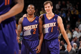 DENVER, CO - December 20:  Eric Bledsoe #2 and Goran Dragic #1 of the Phoenix Suns smile and walk off the court against the Denver Nuggets on December 20, 2013 at the Pepsi Center in Denver, Colorado. NOTE TO USER: User expressly acknowledges and agrees t