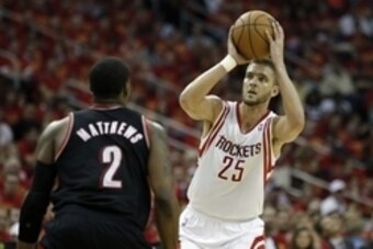 Apr 30, 2014; Houston, TX, USA; Houston Rockets forward Chandler Parsons (25) is defended by Portland Trail Blazers guard Wesley Matthews (2) during the second quarter in game five of the first round of the 2014 NBA Playoffs at Toyota Center. Mandatory Cr