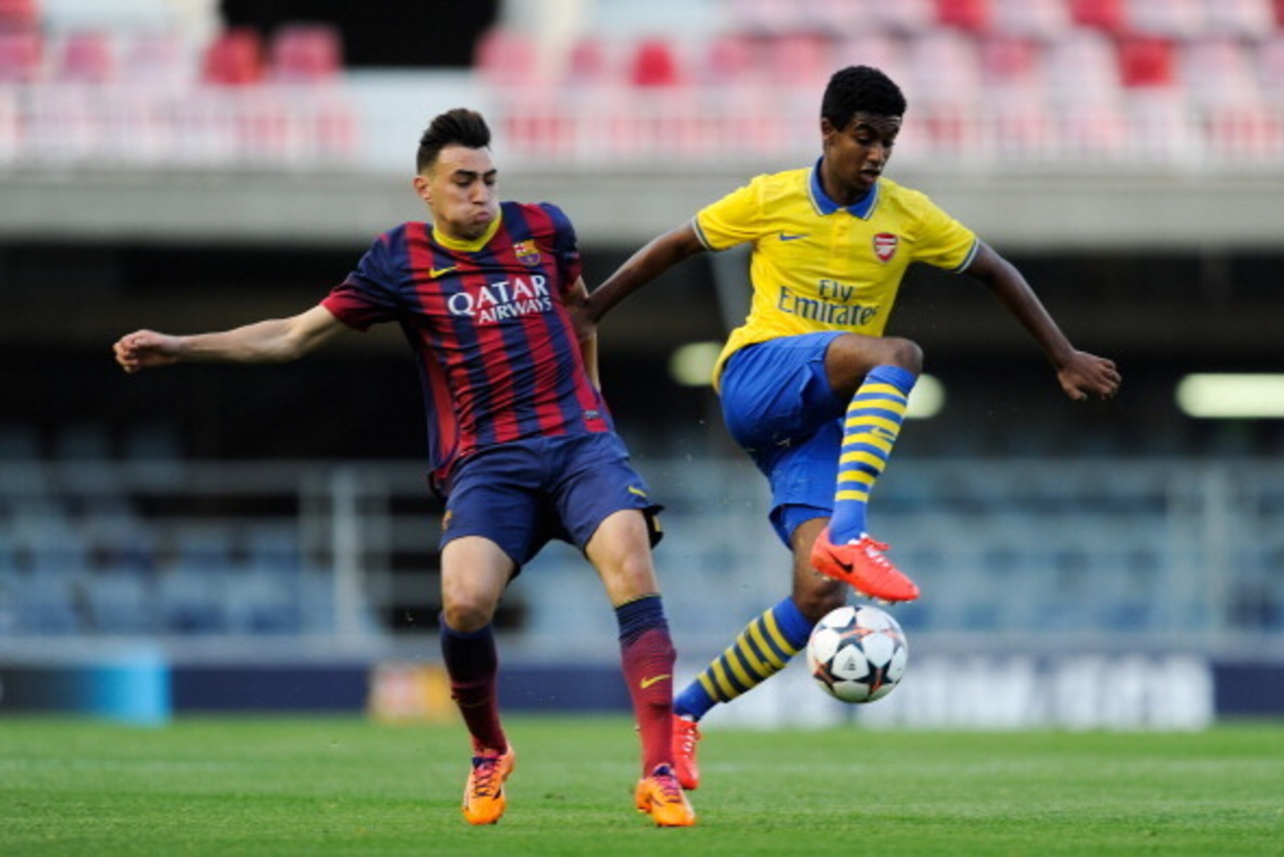 BARCELONA, SPAIN - MARCH 18:  Gedion Zelalem of Arsenal duels for the ball with Munir El Haddadi of FC Barcelona during the UEFA Youth League Quarter FInal match between FC Barcelona U19 and Arsenal U19 at Mini Estadi on March 18, 2014 in Barcelona, Spain