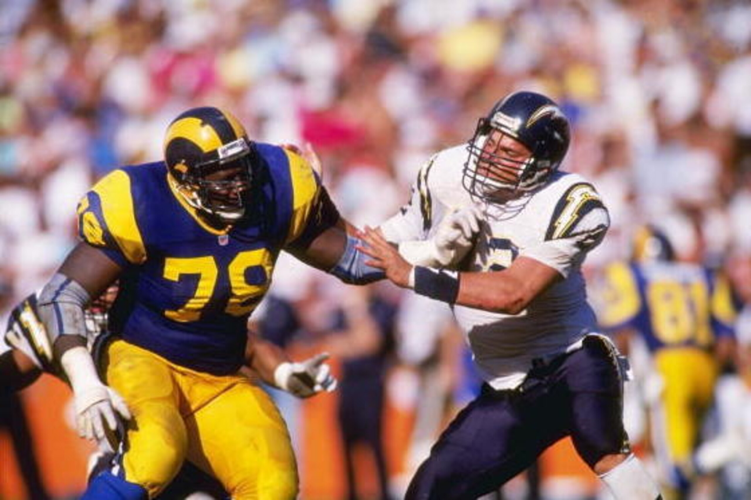 13 Oct 1991:  Offensive lineman Jackie Slater of the Los Angeles Rams (left) and San Diego Chargers defensive lineman Burt Gross man tangle up during a game at Anaheim Stadium in Anaheim, California.  The Rams won the game, 30-24. Mandatory Credit: Stephe