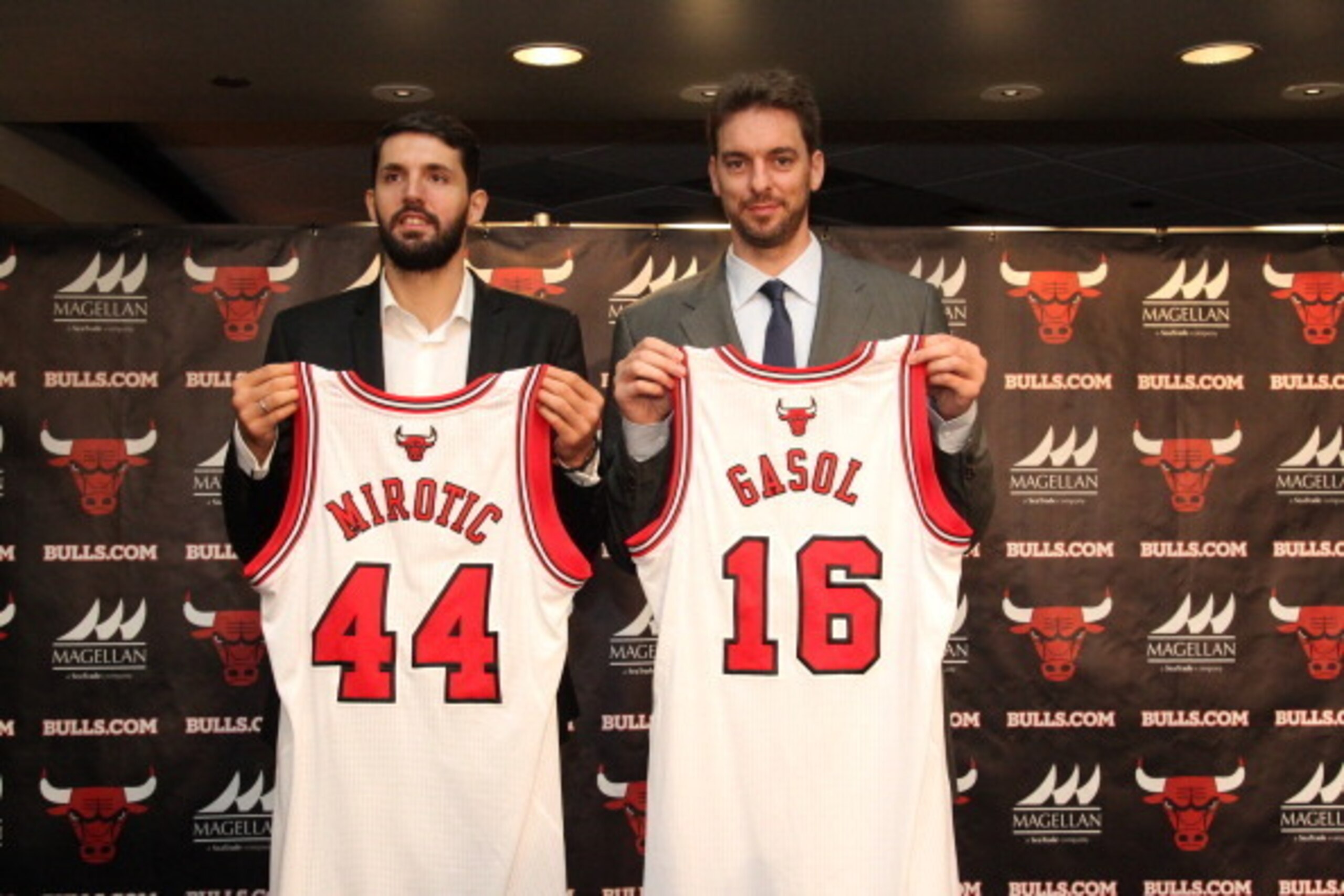 CHICAGO, IL - JULY 18: Chicago Bulls general manager Gar Forman and head coach Tom Thibodeau introduce newly-signed free agents Nikola Mirotic and Pau Gasol during a press conference at the United Center on July 18, 2014  in Chicago, Illinois. NOTE TO USE