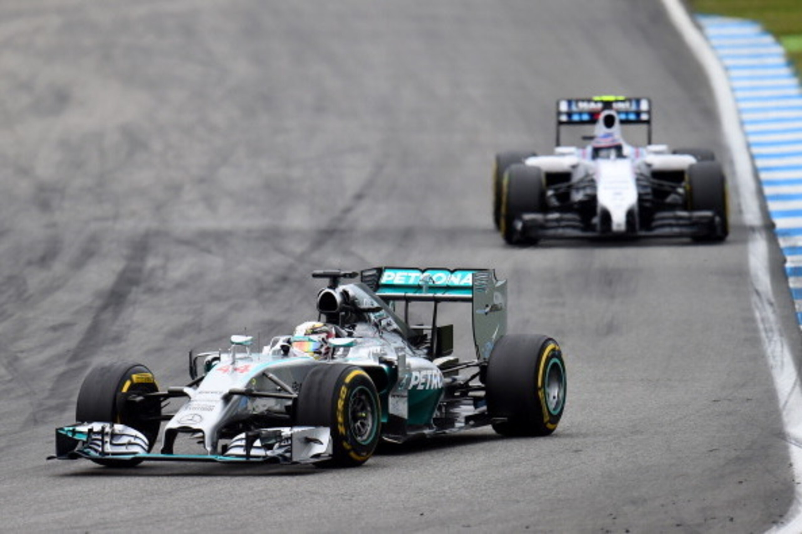HOCKENHEIM, GERMANY - JULY 20:  Lewis Hamilton of Great Britain and Mercedes GP drives during the German Grand Prix at Hockenheimring on July 20, 2014 in Hockenheim, Germany.  (Photo by Christopher Lee/Getty Images)