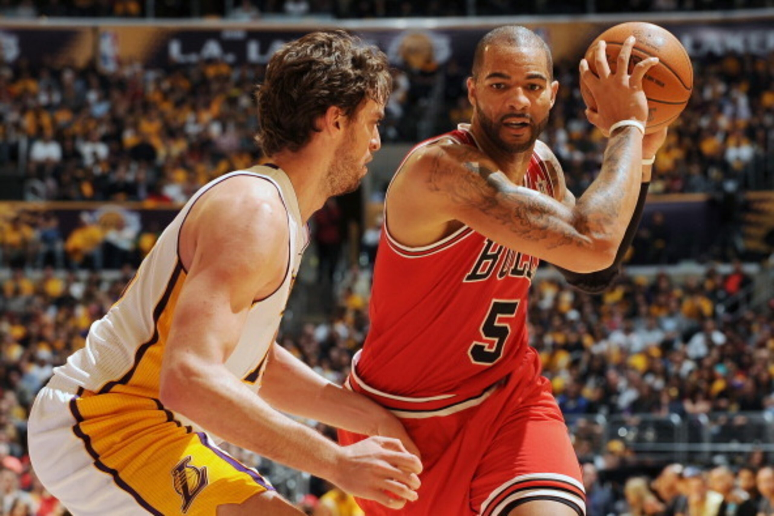 LOS ANGELES, CA - DECEMBER 25: Carlos Boozer #5 of the Chicago Bulls is defended by Pau Gasol #16 of the Los Angeles Lakers at Staples Center on December 25, 2011 in Los Angeles, California. NOTE TO USER: User expressly acknowledges and agrees that, by d LOS ANGELES, CA - DECEMBER 25: Carlos Boozer #5 of the Chicago Bulls is defended by Pau Gasol #16 of the Los Angeles Lakers at Staples Center on December 25, 2011 in Los Angeles, California. NOTE TO USER: User expressly acknowledges and agrees that, by d