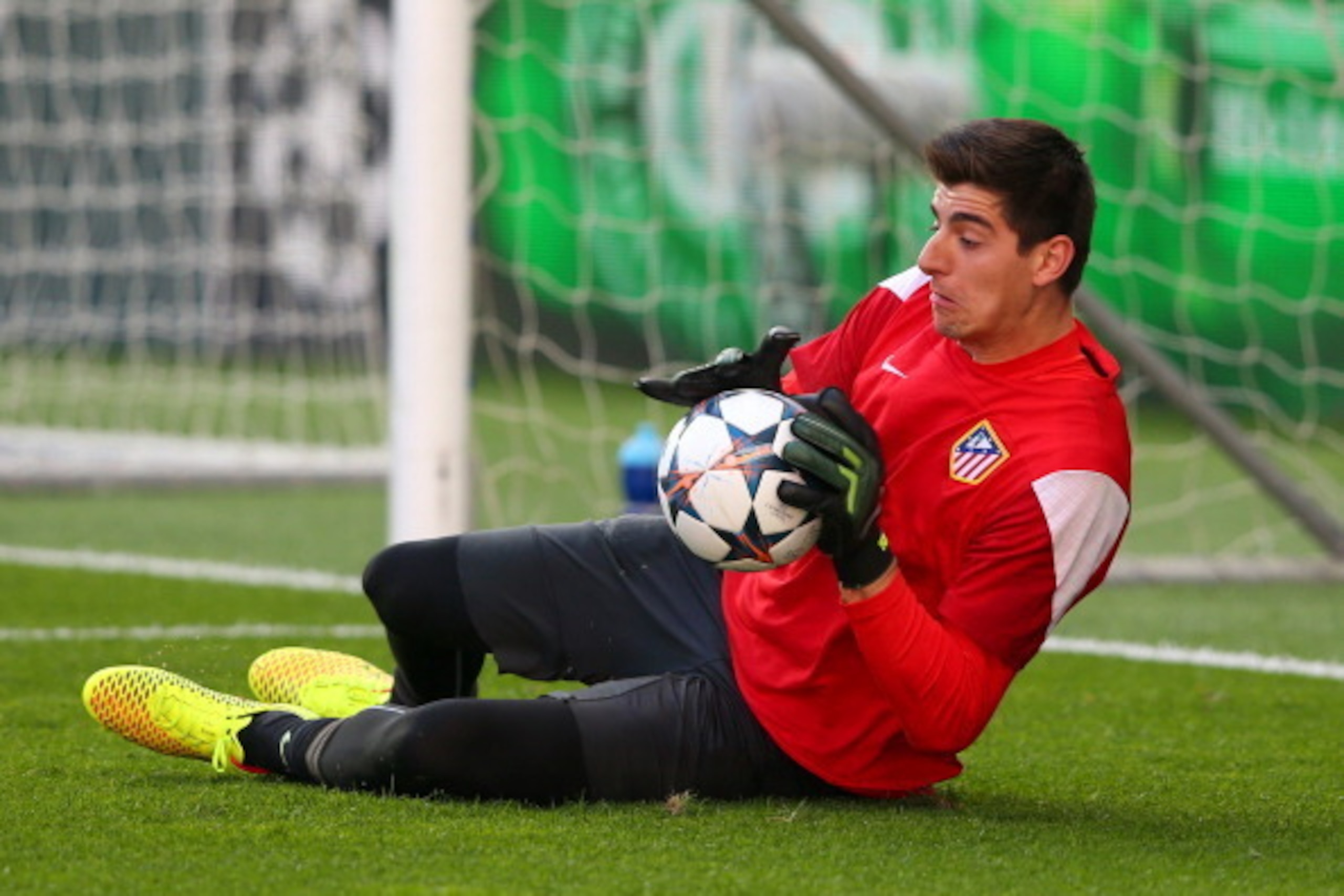 LISBON, PORTUGAL - MAY 23:  Thibaut Courtois of Club Atletico de Madrid makes a save during a Club Atletico de Madrid training session ahead of the UEFA Champions League Final against Real Madrid at Estadio da Luz on May 23, 2014 in Lisbon, Portugal.  (Ph