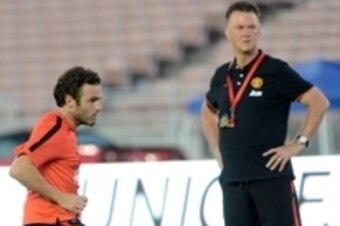 Jul 22, 2014; Pasadena, CA, USA;  Manchester United head coach Louis Van Gaal (right) watches midfielder Juan Mata (8) during team practice before the game on July 23 against the Los Angeles Galaxy at the Rose Bowl. Mandatory Credit: Jayne Kamin-Oncea-USA