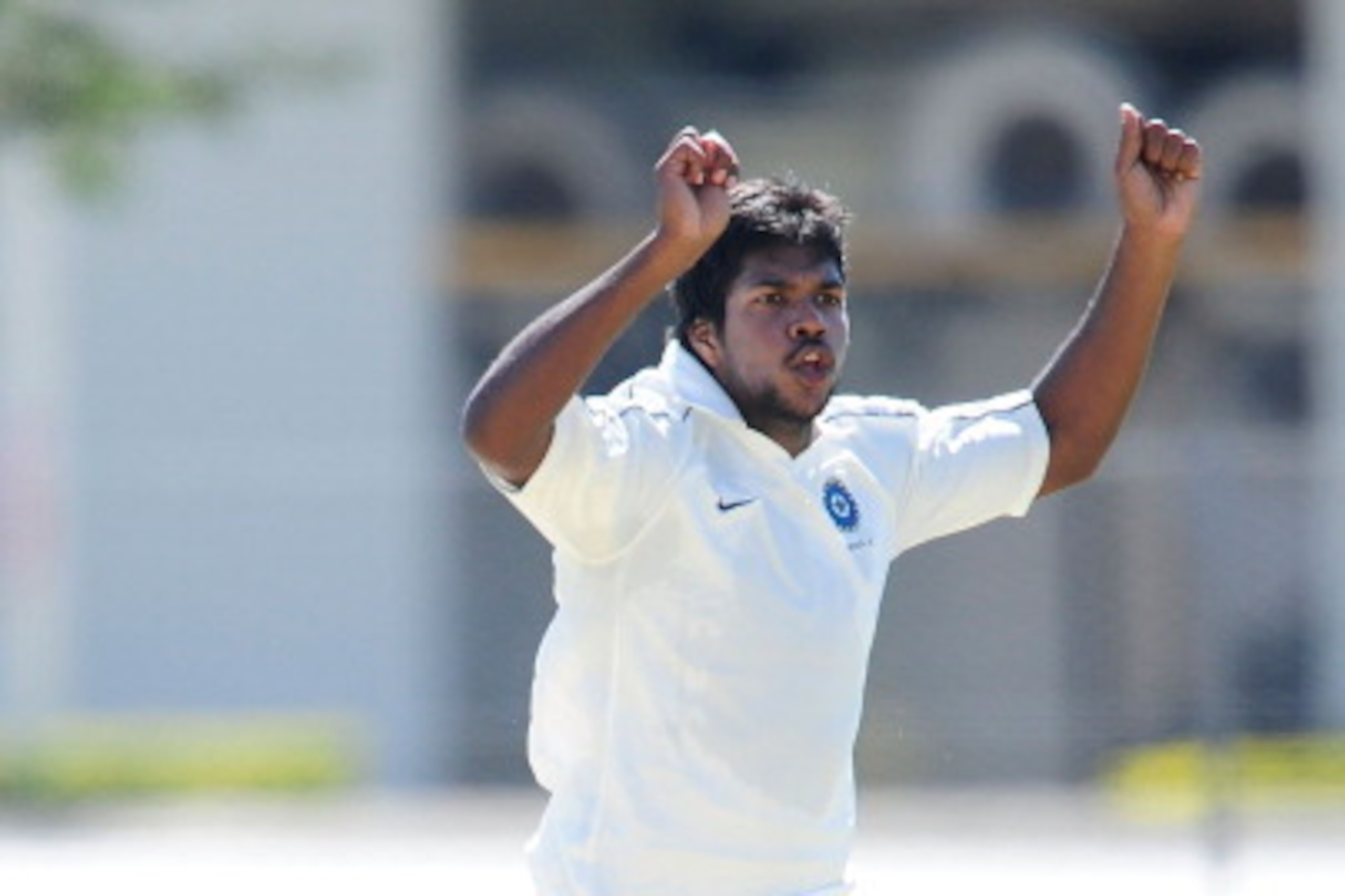 TOWNSVILLE, AUSTRALIA - AUGUST 13:  Varun Aaron of India reacts after bowling during the Emerging Players Tournament match between the AIS and India at Endeavour Park on August 13, 2011 in Townsville, Australia.  (Photo by Ian Hitchcock/Getty Images)